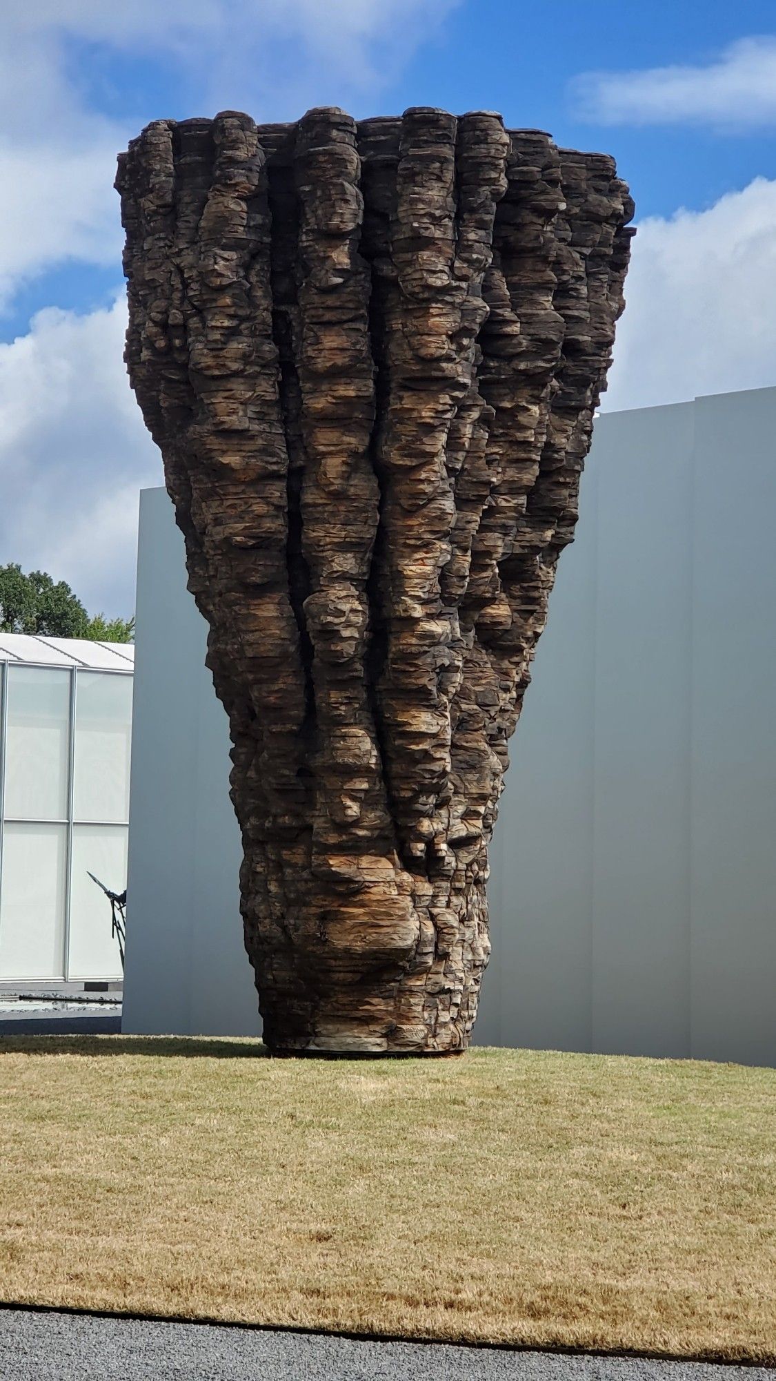 Ursula von Rydingsvard 

Ogromna, 2009

A huge, I mean giant. It's about 10 feet taller than the art museum building behind it. inverted trapezoid shaped cone. It's made of increasingly wider slabs of cedar and granite