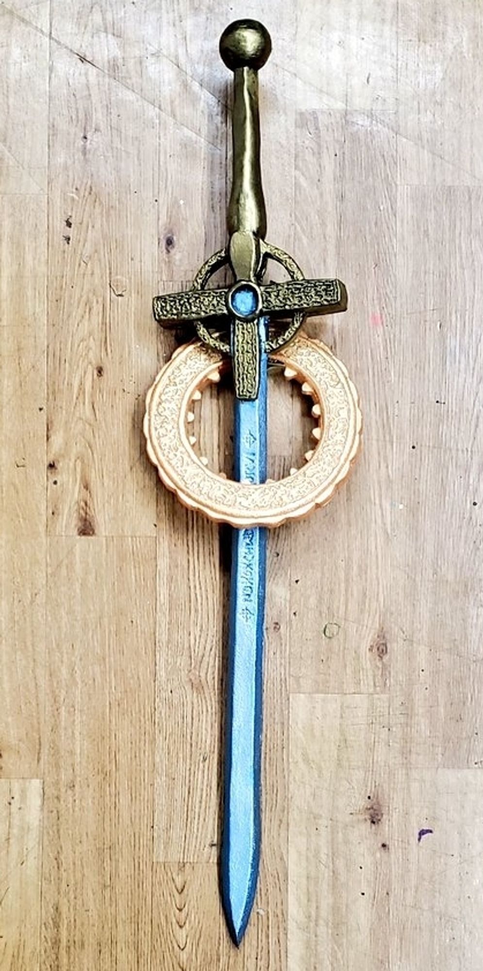 a foam prop replica of the cruciform sword and halo from the netflix series warrior nun