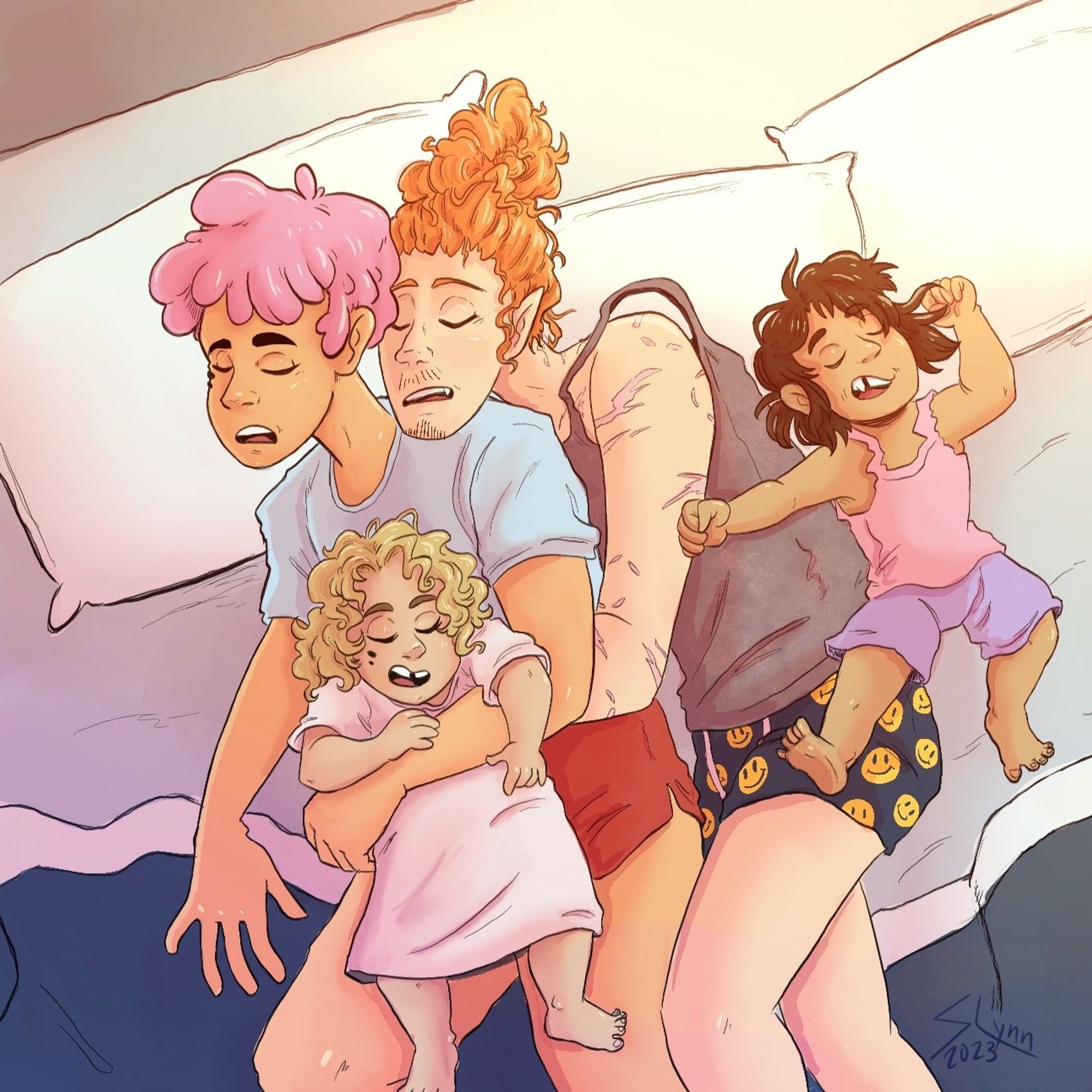 A family of four, two dads and their toddler daughters snuggling in bed