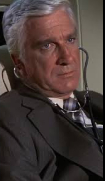 This is a picture of Dr. Rumack (played by Lesley Nielsen) from the movie Airplane! (1980)