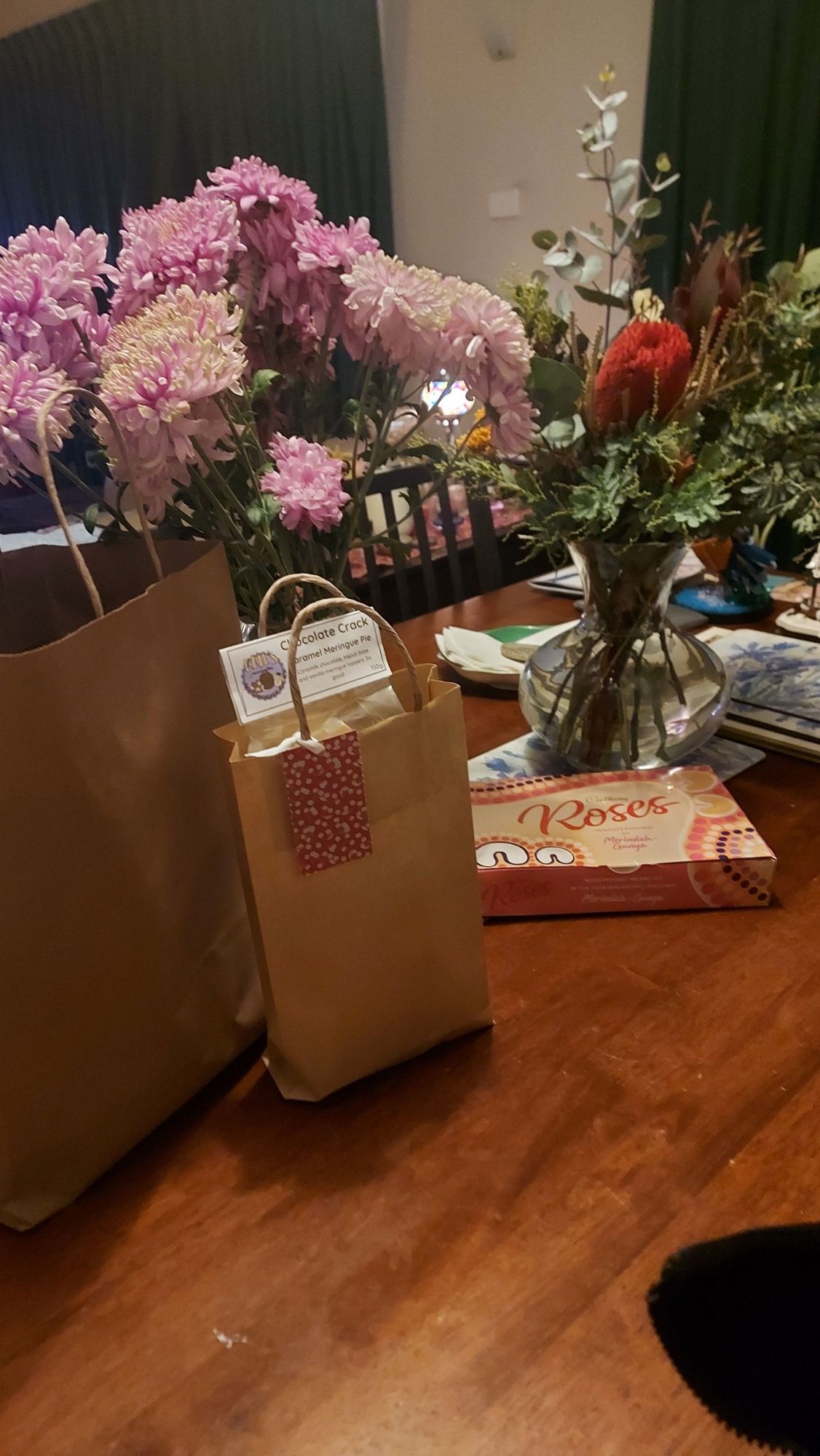 2 bunches of flowers shoved into vases along with some Cadbury roses chocolates & 2 paper bags of goodies. Thankyou presents from the dancers to their teacher/rehearsal assistant after their 5 run show