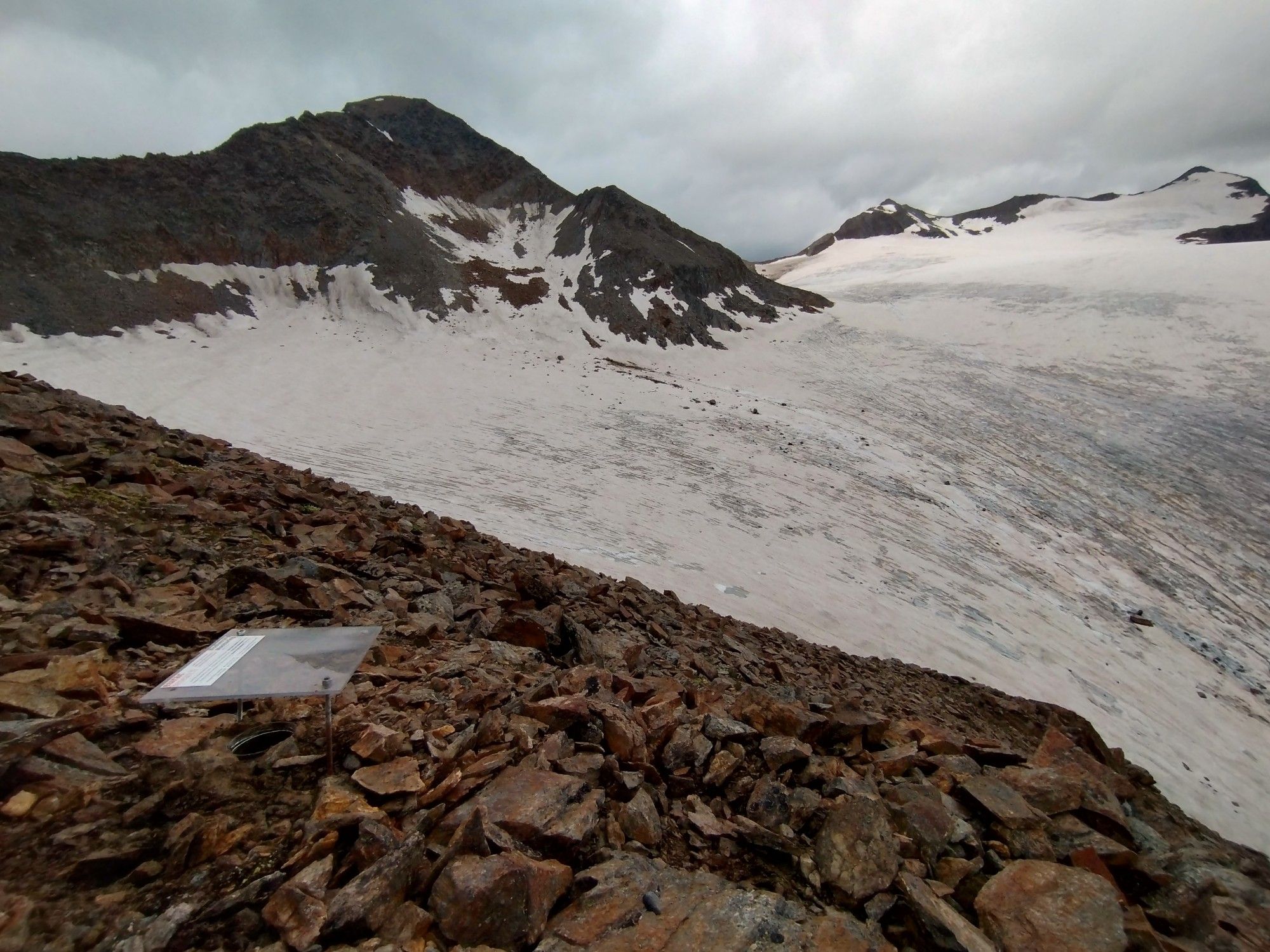 A pitfall trap installed at 3300m to capture ground-dwelling soil fauna. In the background a snow-covered glacier.