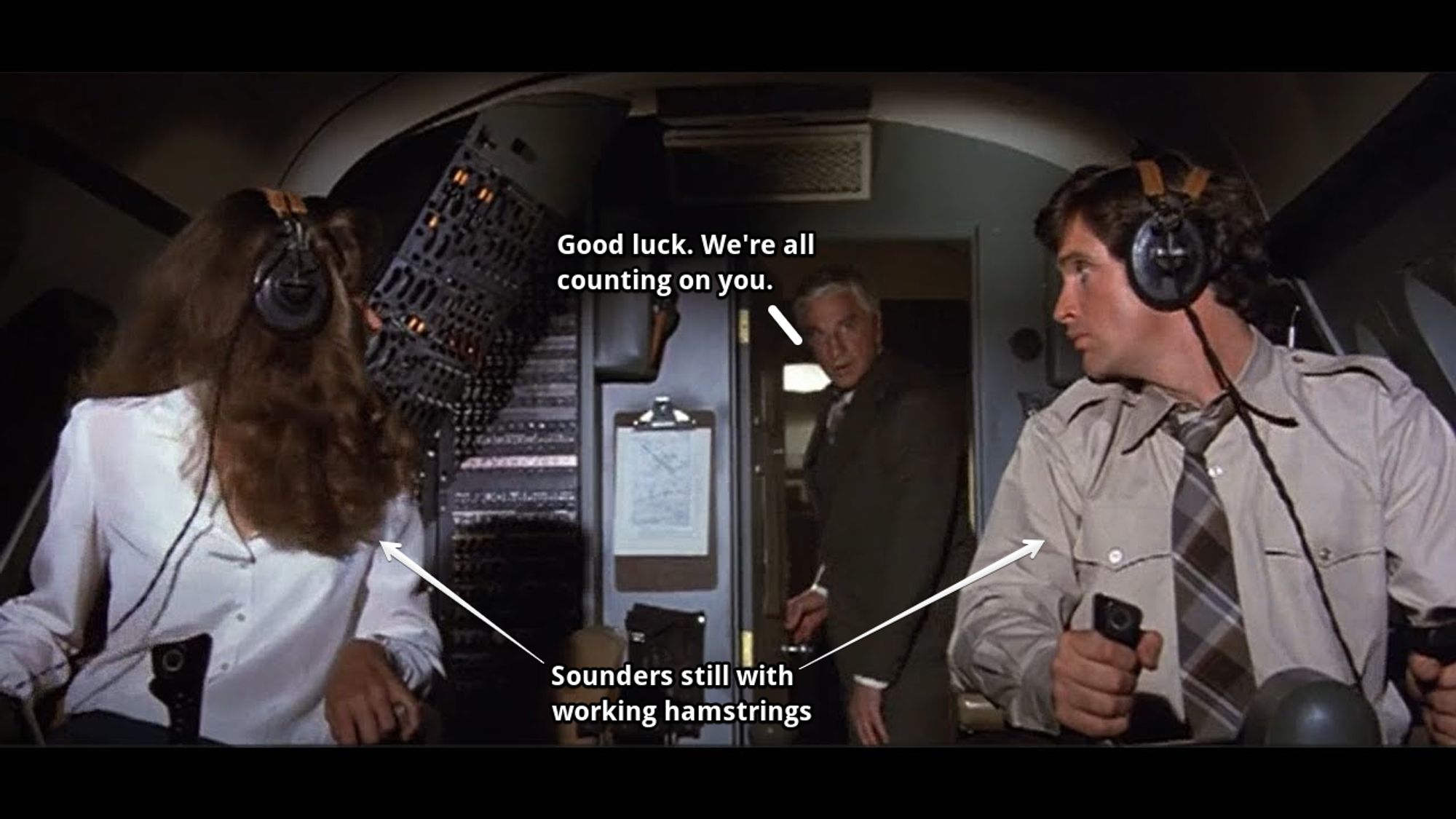 Screenshot from Airplane! The Movie. Two people in the pilot seats looking back at man who says through the cockpit doorway "good luck we're all counting on you"