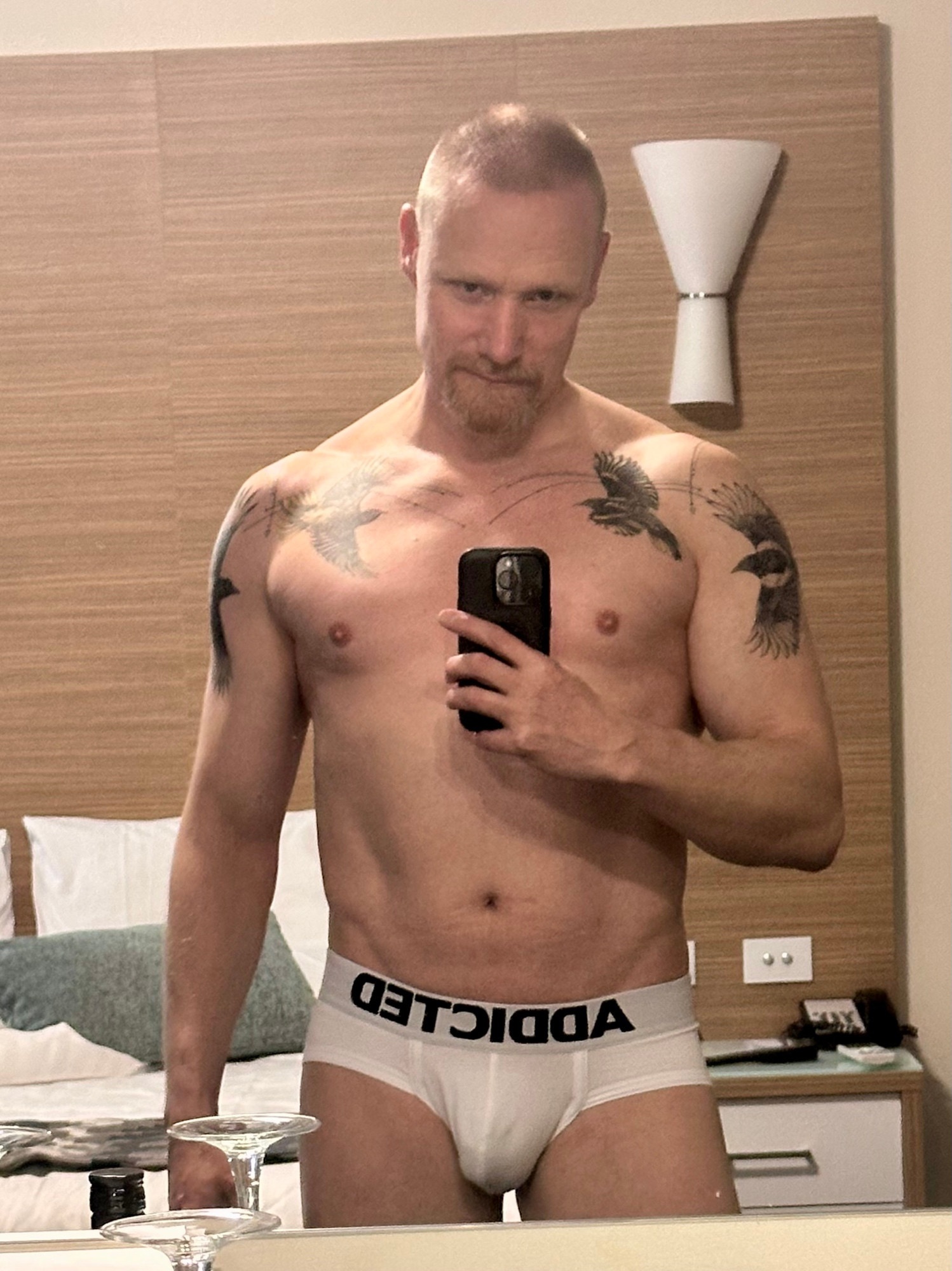 Mirror selfie of Timo ending just below his junk. He’s wearing white Addicted briefs.