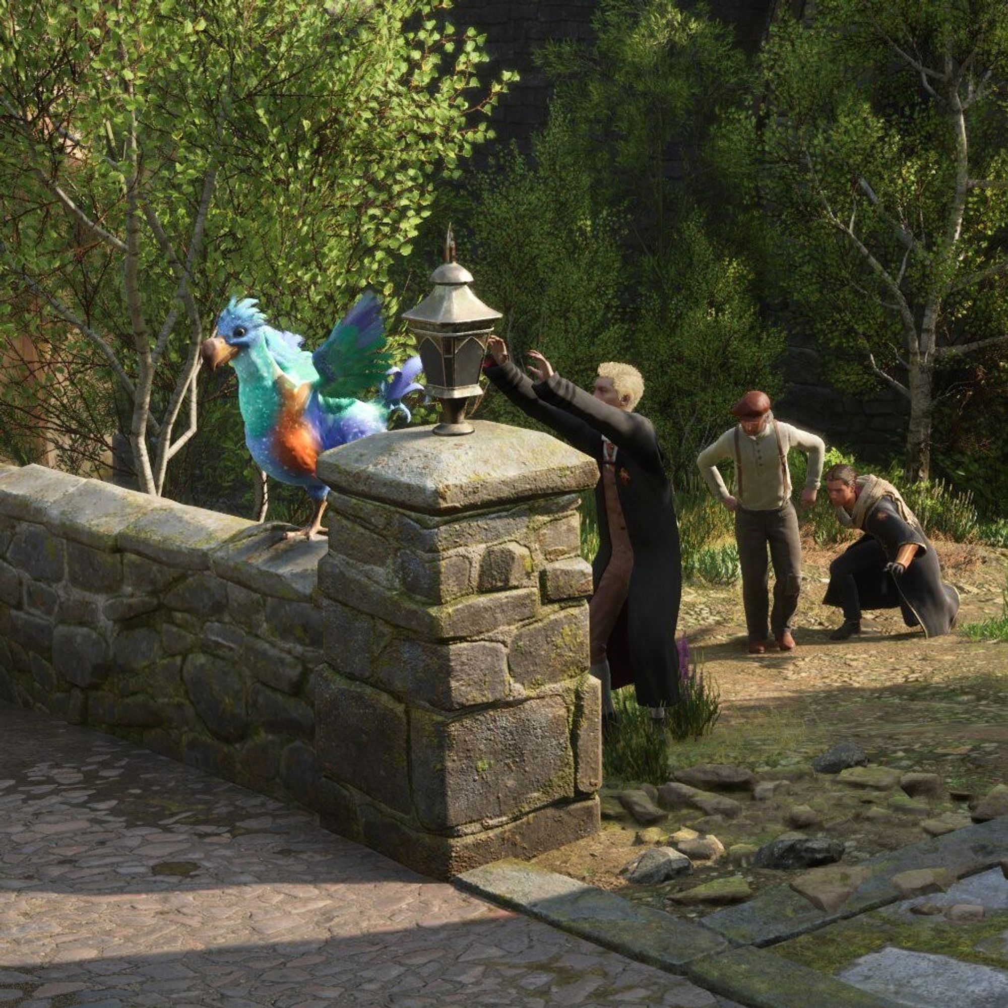 Three wizards from Hogwarts Legacy trying to catch a colorful, magical bird perched on a stone wall, with one wizard reaching out while the others watch amusingly