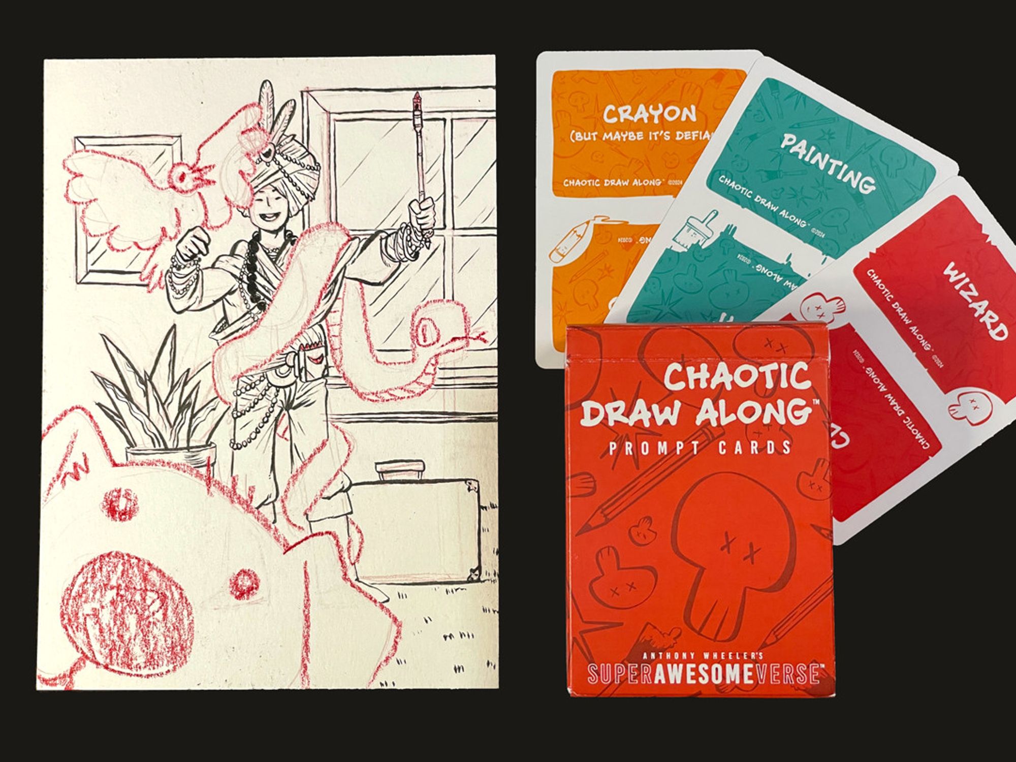 A photo of the previous illustration next to three cards and a deck box. Each card has a prompt word: "crayon", "painting", and "wizard", respectively. The deck box reads, "Chaotic Draw Along: Prompt Cards".