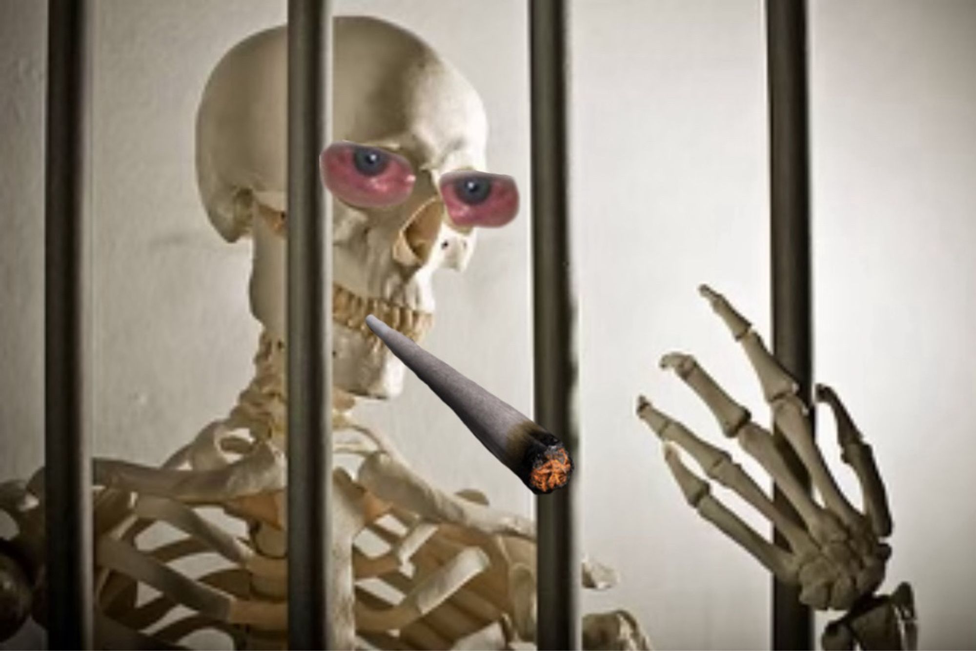 Scary skeleton behind bars of hard iron with really red eyes and a very large Joint