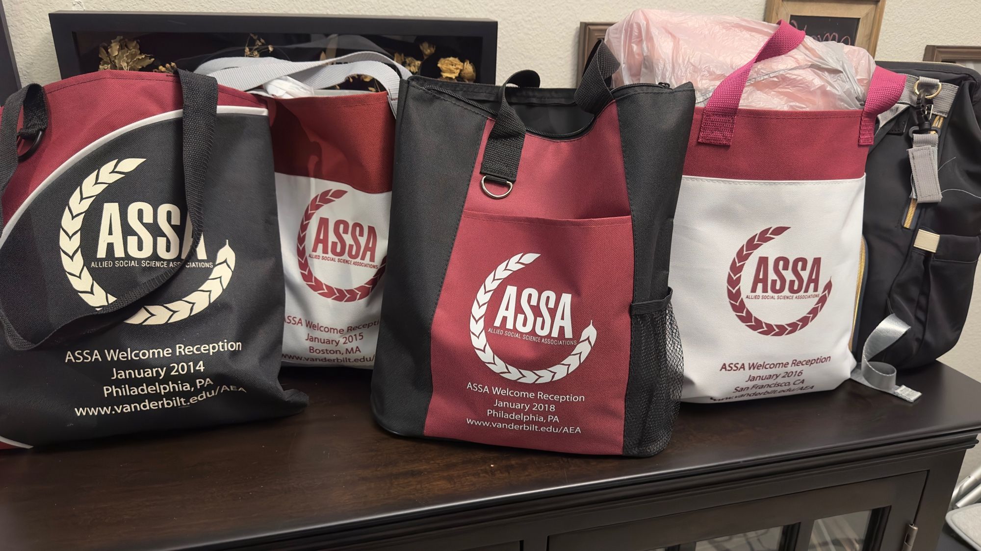 a set of tote bags that all have ASSA branding