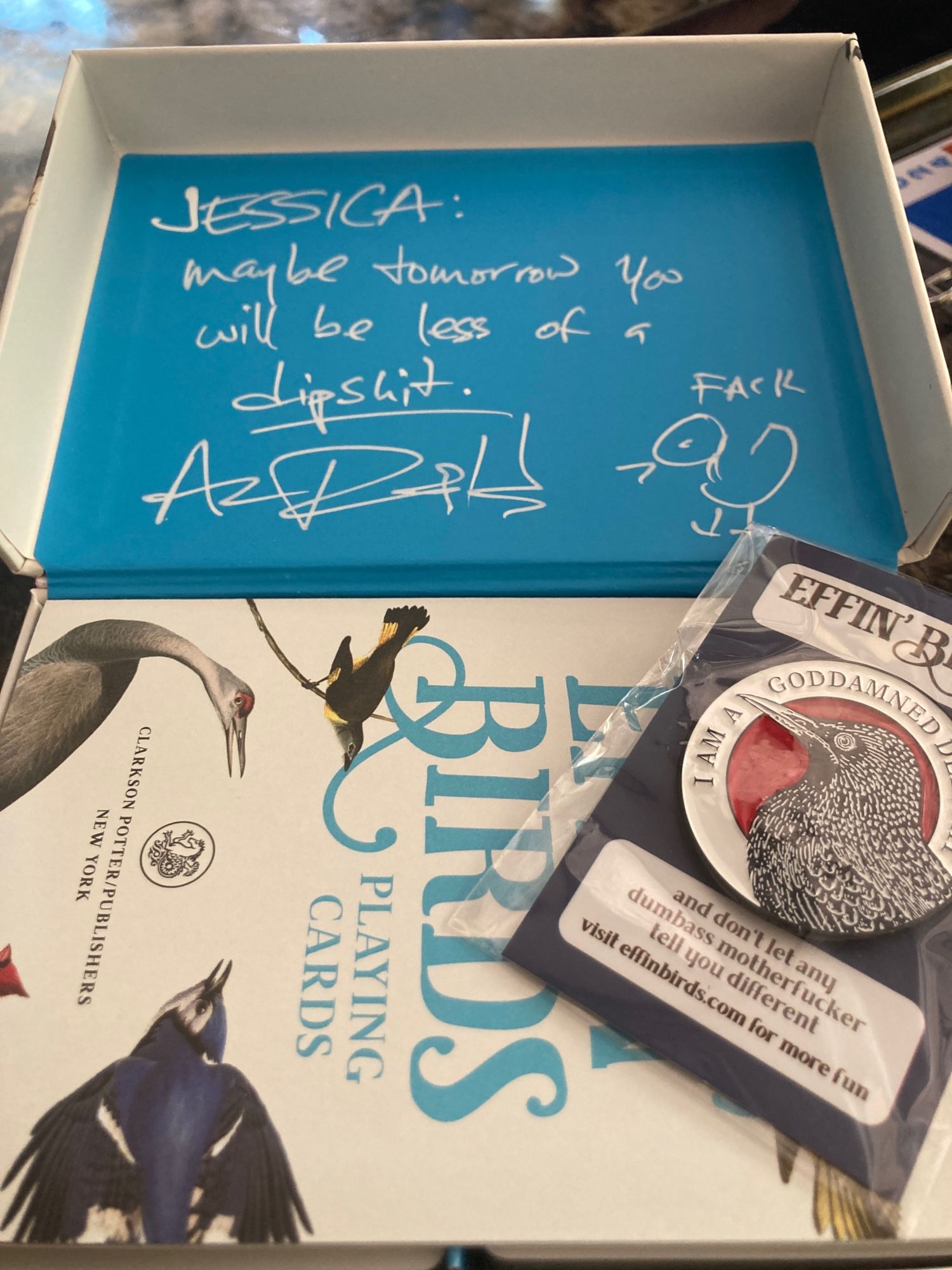 Signed playing cards that say “Jessica: maybe tomorrow you will be less of a dipshit.”