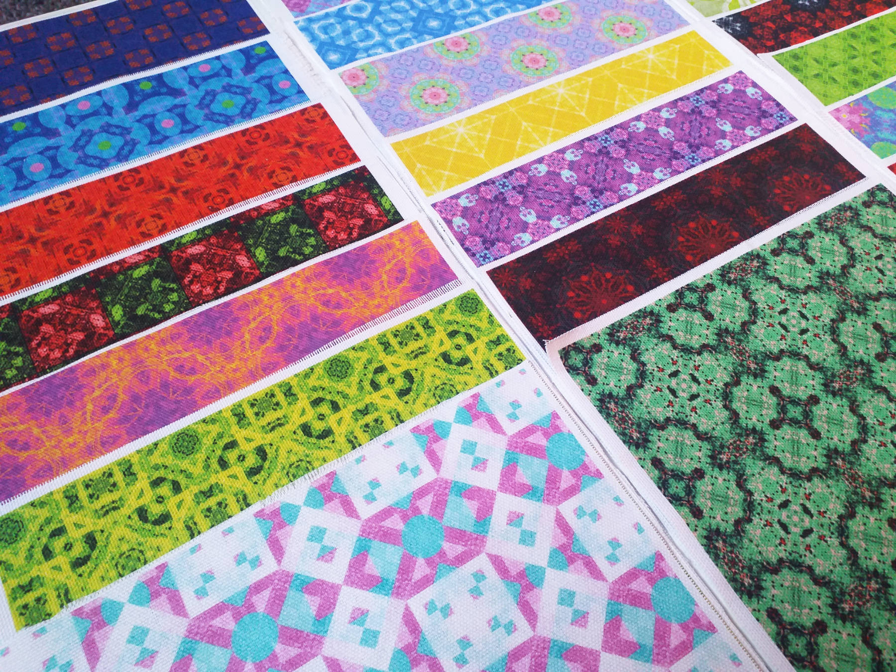 Various abstract shaped pattern designs printed on Panama Cotton. They are laid out in an artistic manner.