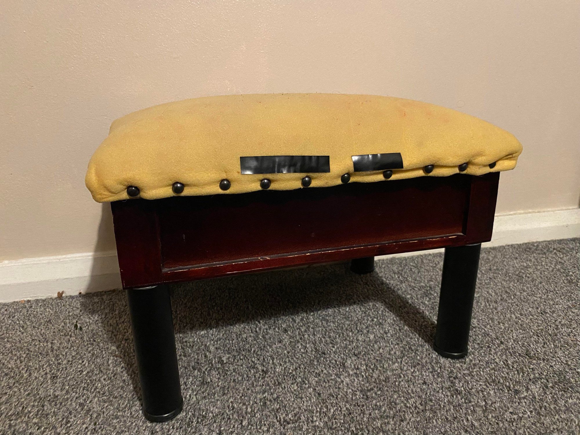 Footstool with a new MDF lid with the foam attached. Front view.