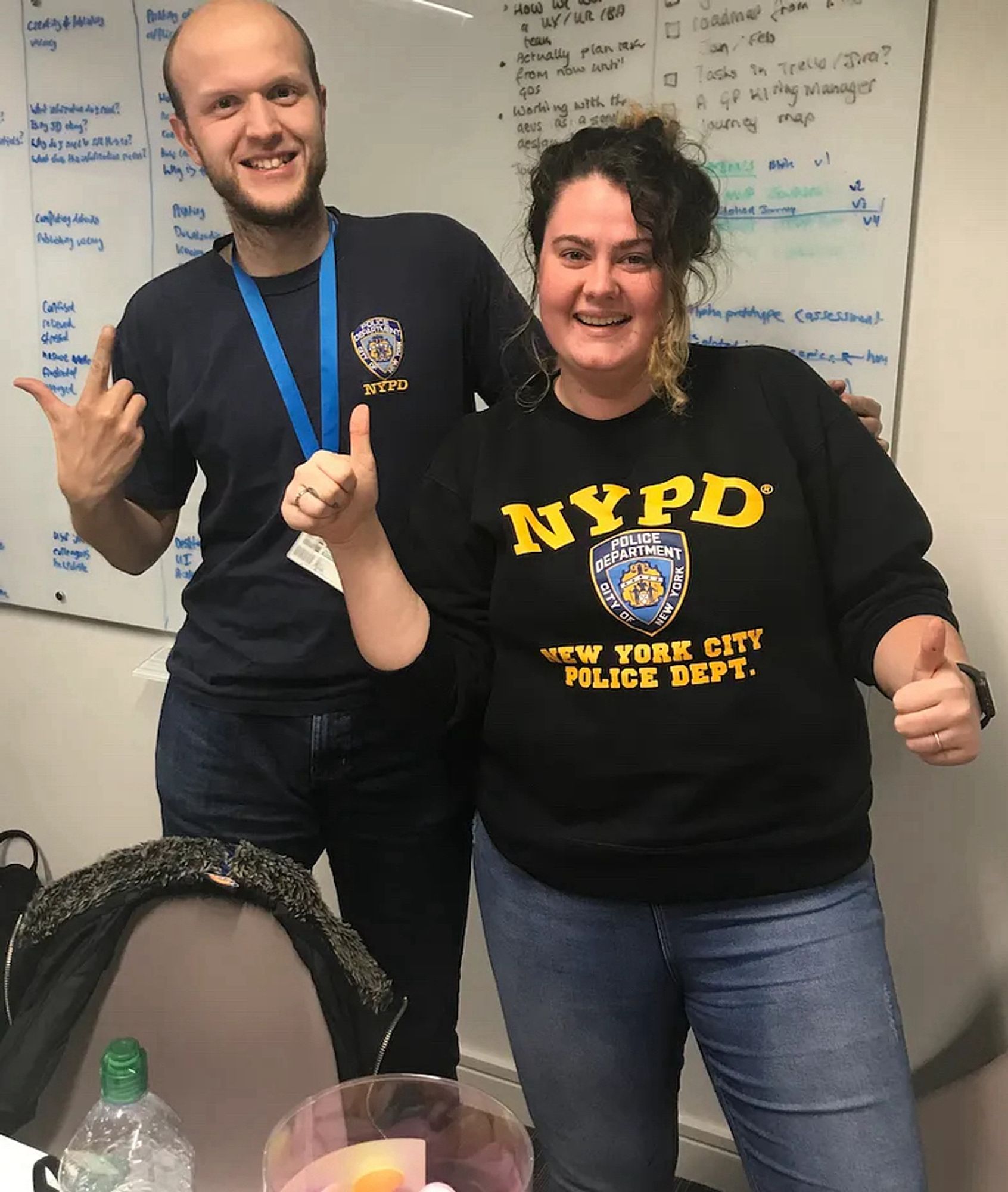 Man and woman wearing NYPD tops