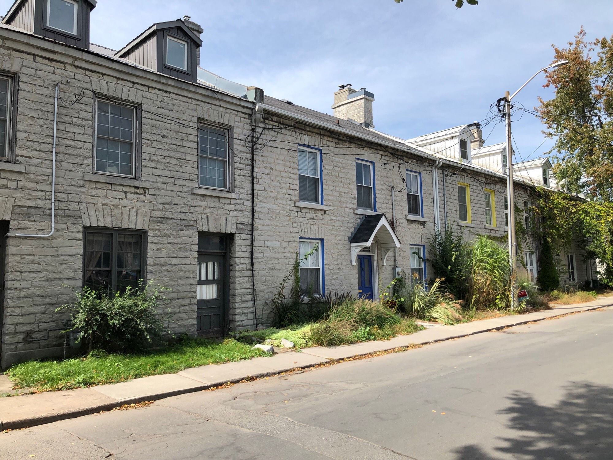 A collection of limestone row houses in the Portsmouth Village neighbourhood in Kingston, ON