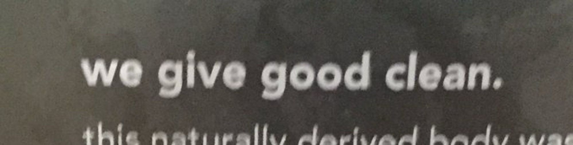 From a bottle of Method brand body wash, a slogan that reads "we give good clean."