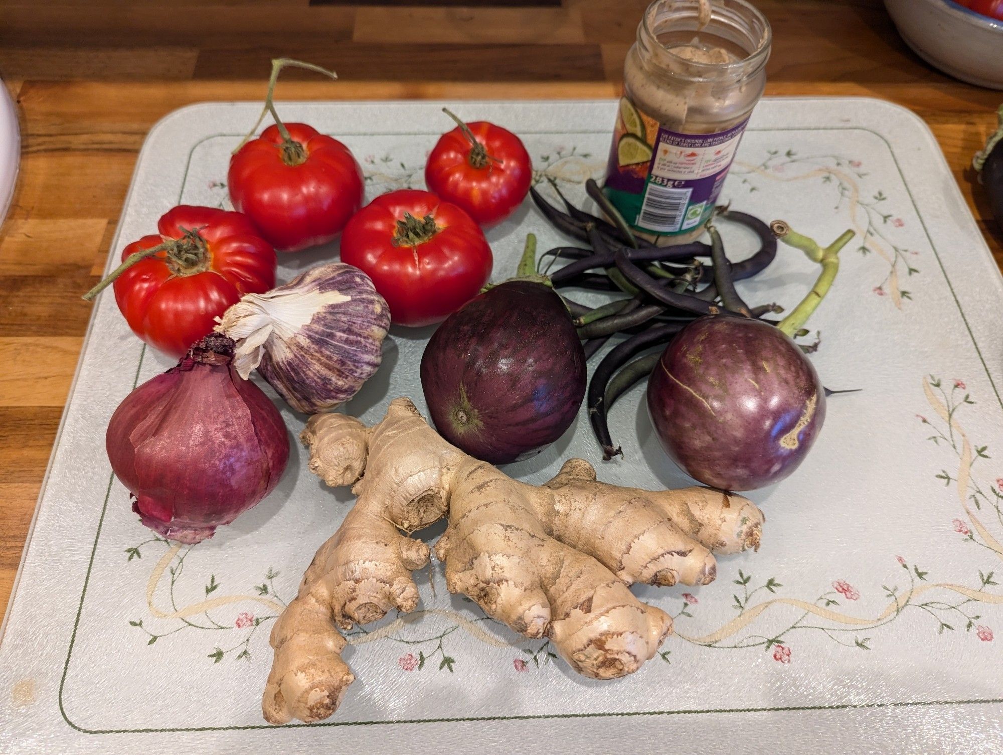 Tomatoes, ginger, garlic, beans, aubergine and a bottle of fermented fish sauce.