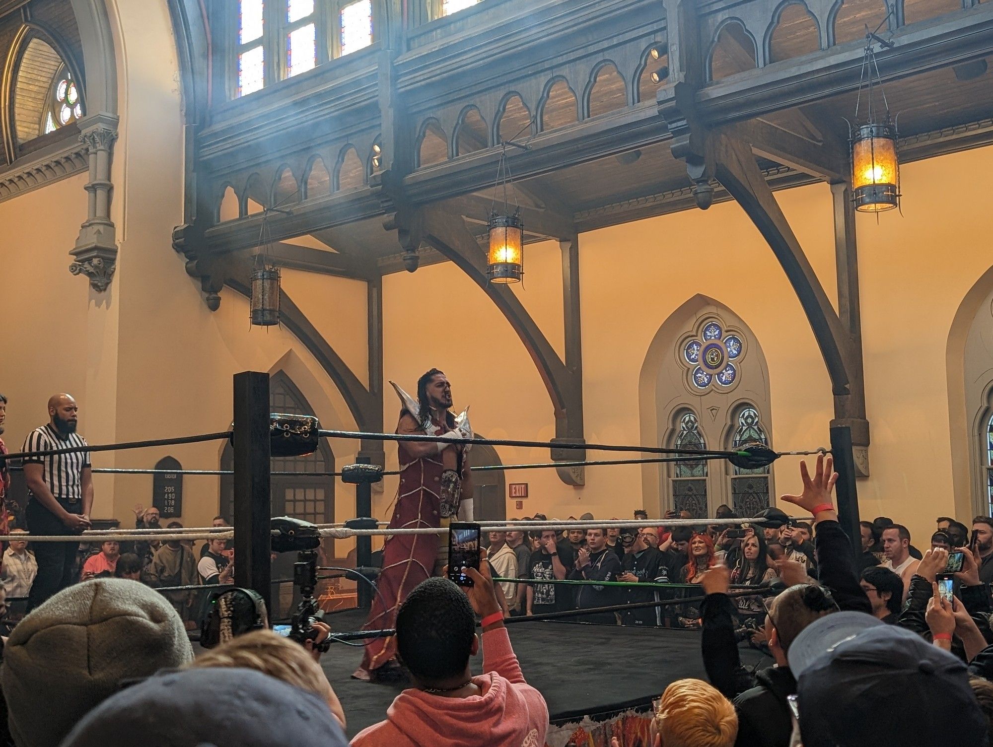 Mustafa Ali in a wrestling ring in a church