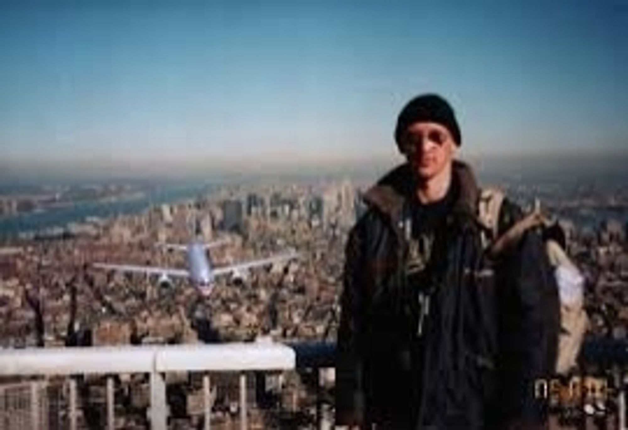 "Tourist Guy", a photo of a guy atop the World Trade towers with a superimposed plane approaching. An early viral hoax in the aftermath of 9/11.