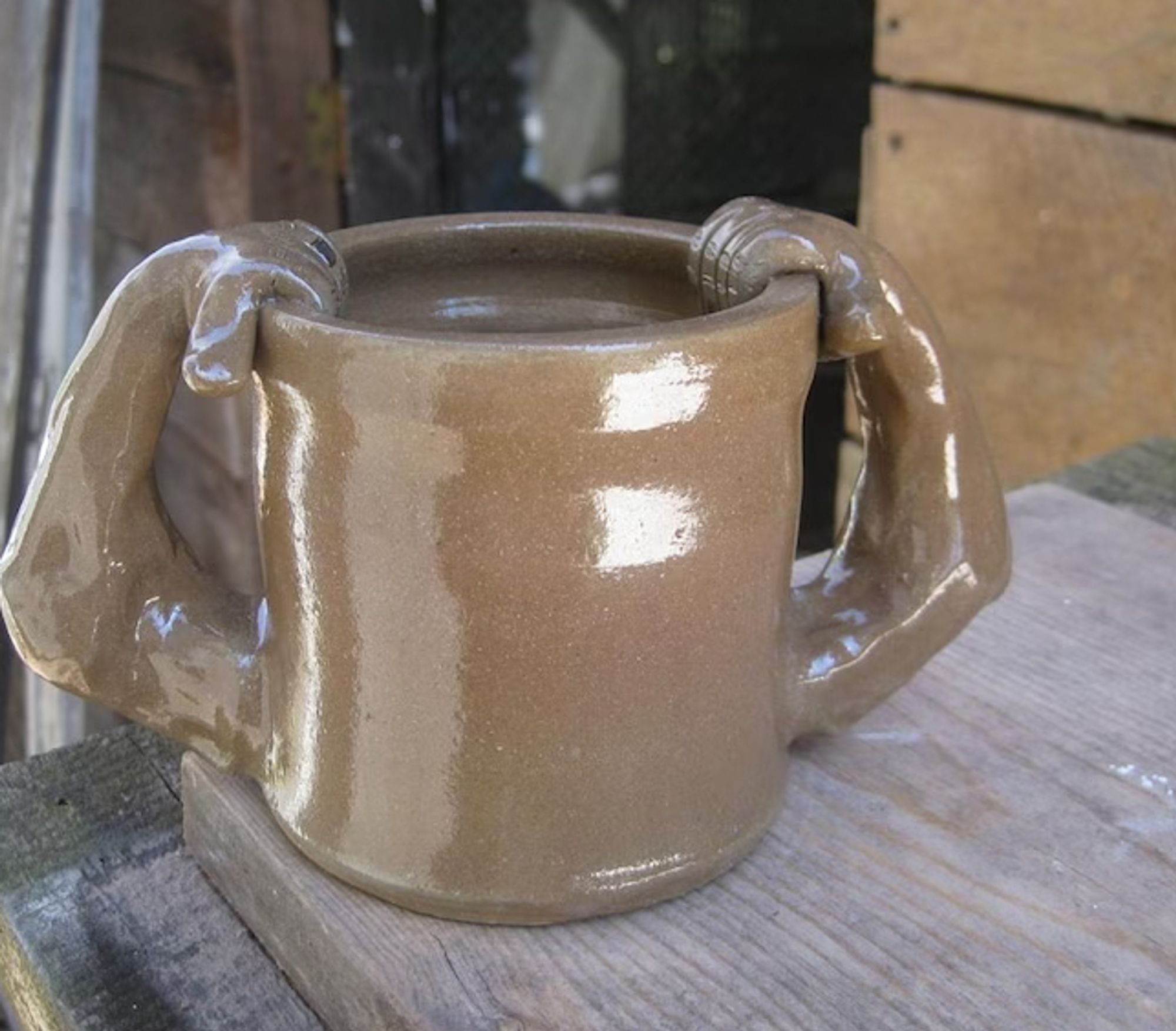 Side View: Anthropomorphic ceramic cup with glaze possibly used to consume psychotropics or for ritual ablutions. Note the enhanced musculature, perhaps indicative of the effort required to spread the opening or the power gained by consuming the contents.