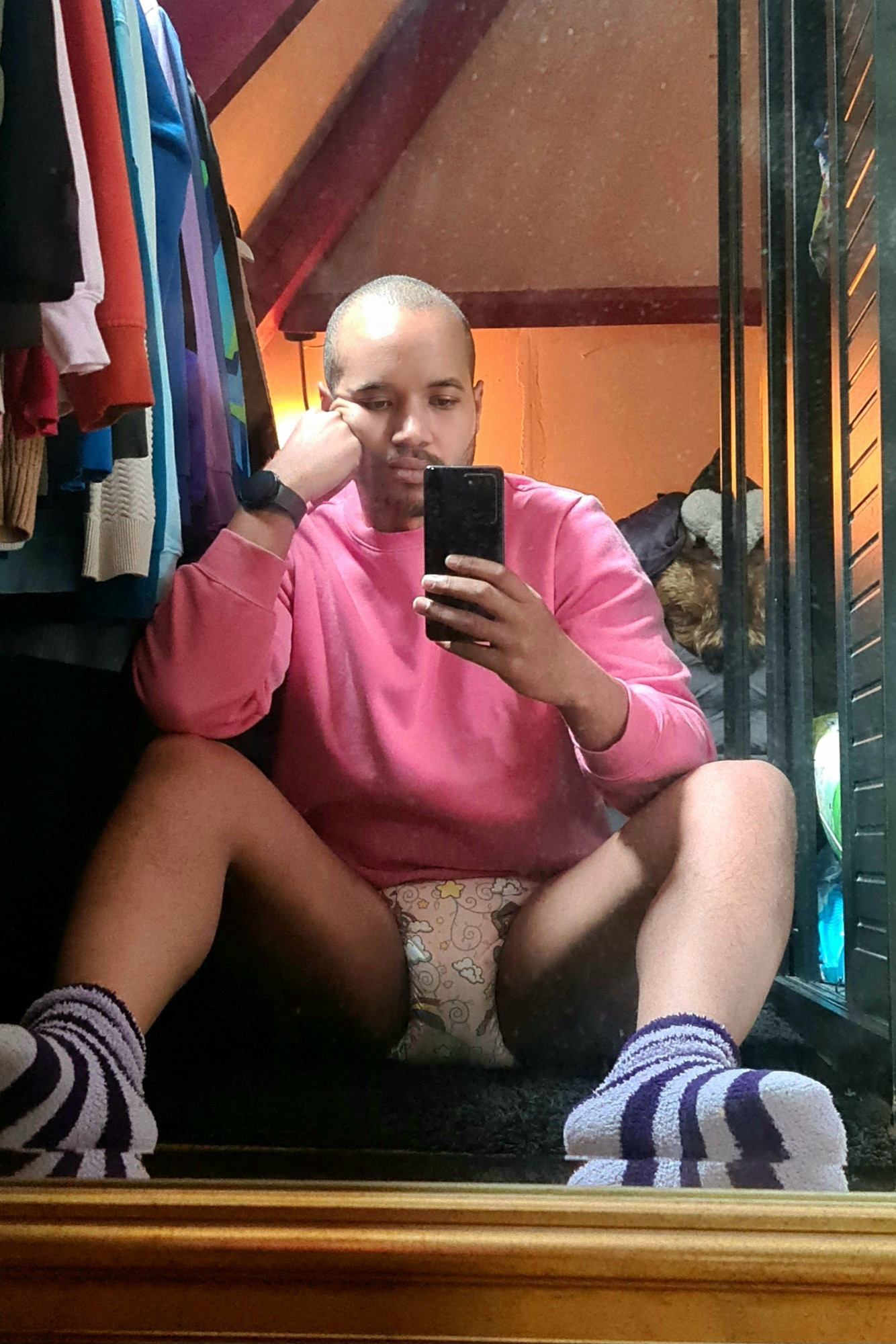 Boy in pink clothes and diaper