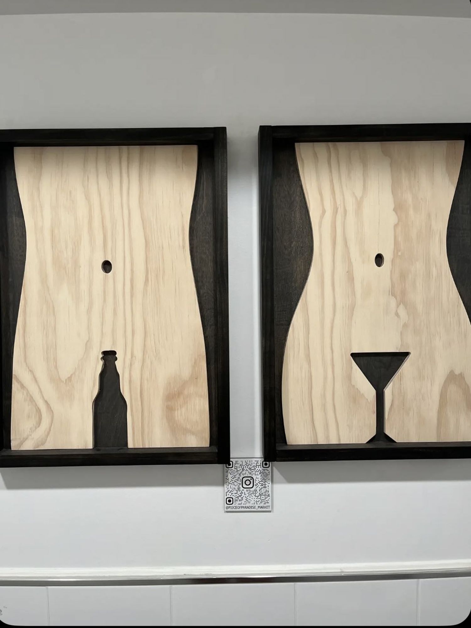 picture of what i think is implied to be the torso of a man with a cutout of a beer where the penish should be, and the torso of a woman with a cutout of a martini glass where the vaginer should be