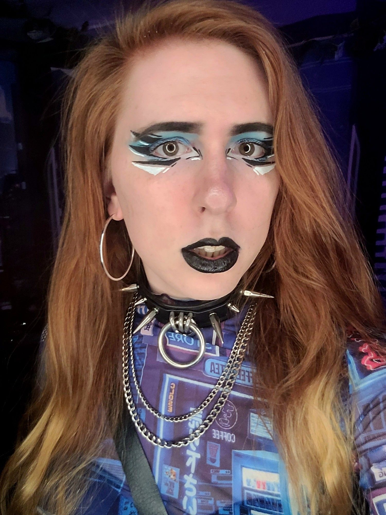 me with cyber lookin makeup and a blue mesh top w a spiky choker