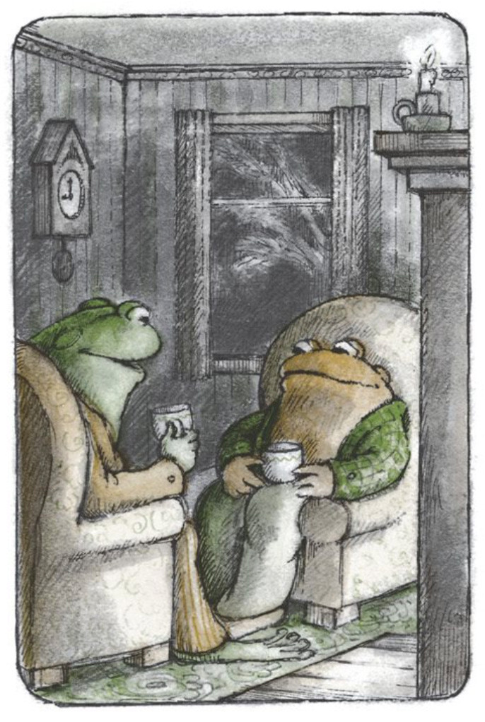 Frog and Toad craddle warm cups of tea in their hands, as they sit in cozy chairs in front of the fire.

From "Shivers"
In *Days with Frog and Toad*