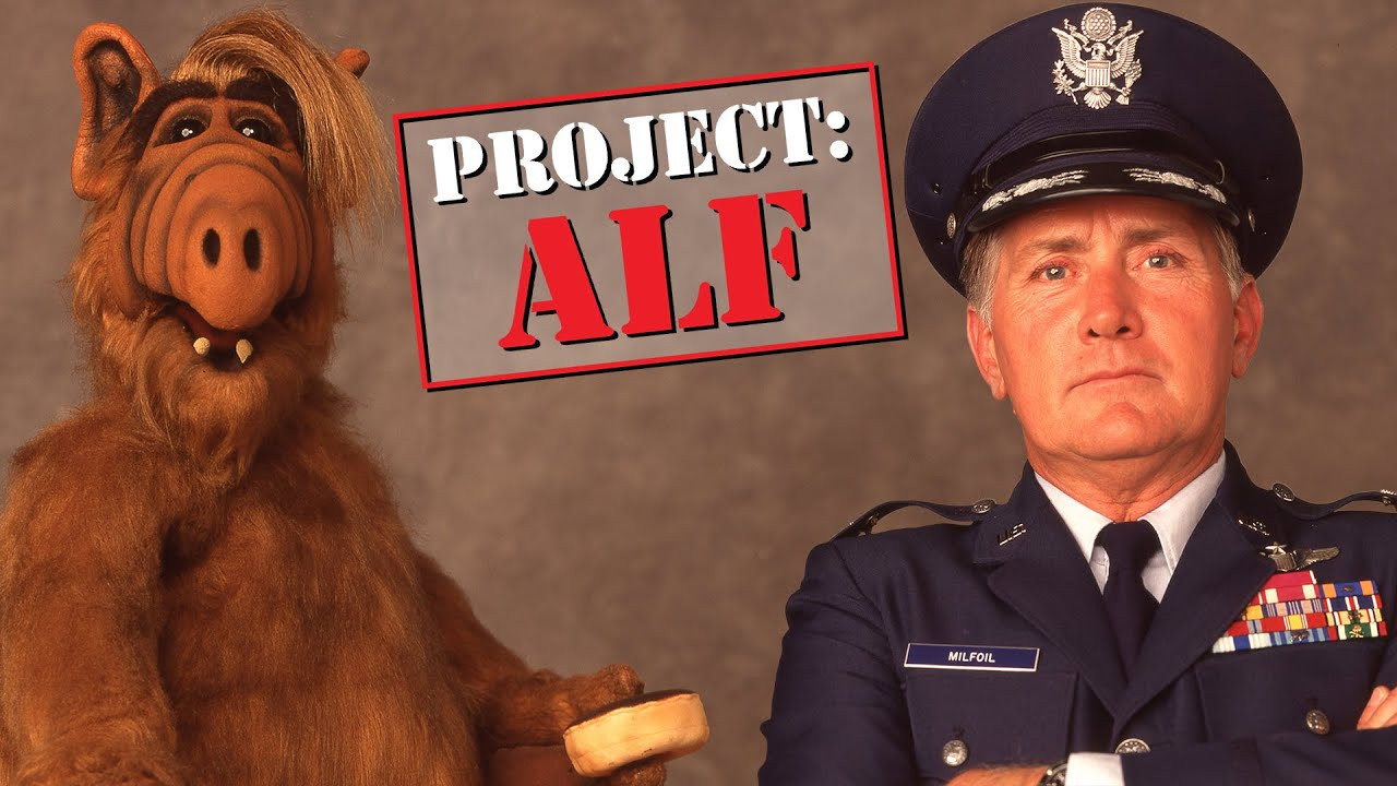 Project Alf. Image features Alf holding a donut (I think) and Martin Sheen in a military uniform.