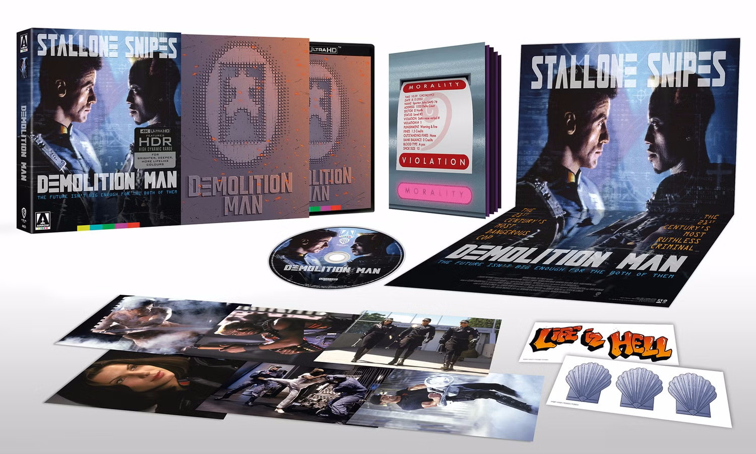 Demolition Man Limited Edition 4K from Arrow Video. Image features the case showing Sylvester Stallone and Wesley Snipes, along with a. matching poster and disc. Also included are some set photos and a sticker of the three seashells and one of the phrase "Life is Hell" in a graffiti-type font.