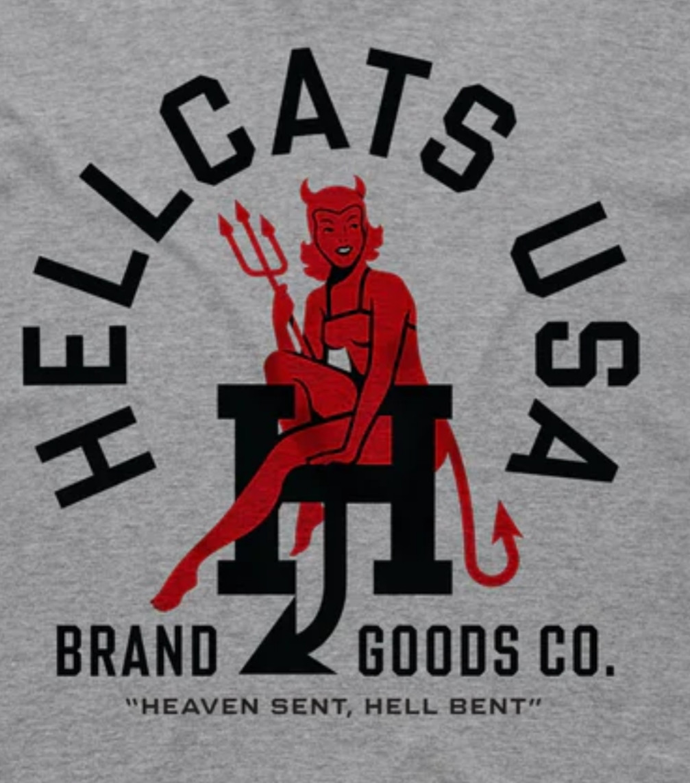 Illustration of a red woman in a devil costume holding a pitchfork sitting on the letter H, with the text Hellcats USA above her.