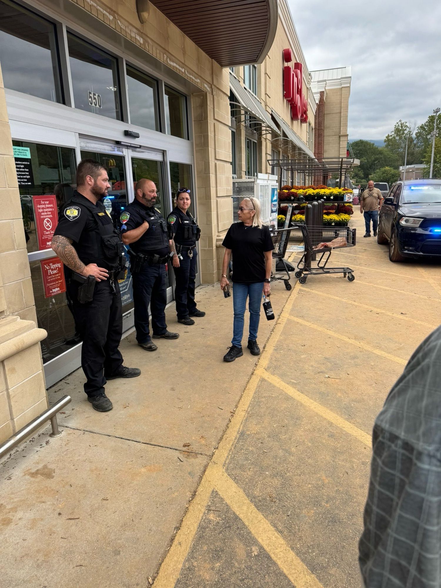 Line of pigs standing in front of a grocery store with hands on their hips