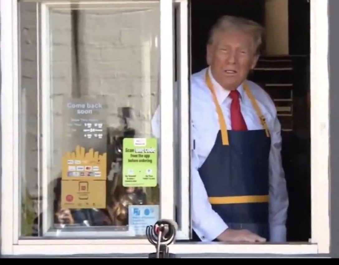 Donald Trump in the drive through lane at McDonalds, “working.”