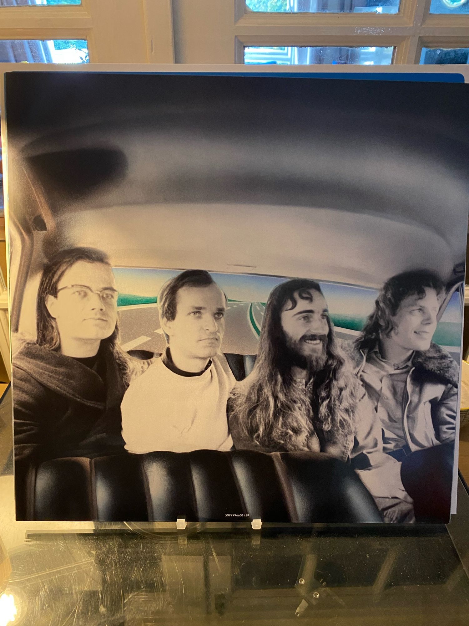 The inner sleeve from Kraftwerk’s album Autobahn. It features a collage of the band members in the rear seat of a car. The view from the rear window is a drawing. No-one has seatbelts on which I think was not a legal requirement at the time. Scary!  From left to right it’s Ralf Hütter, Florian Schneider, Wolfgang Flür and Klaus Röder. Wolfgang and Klaus look like they are having a lovely time. Ralf and Florian…less so.