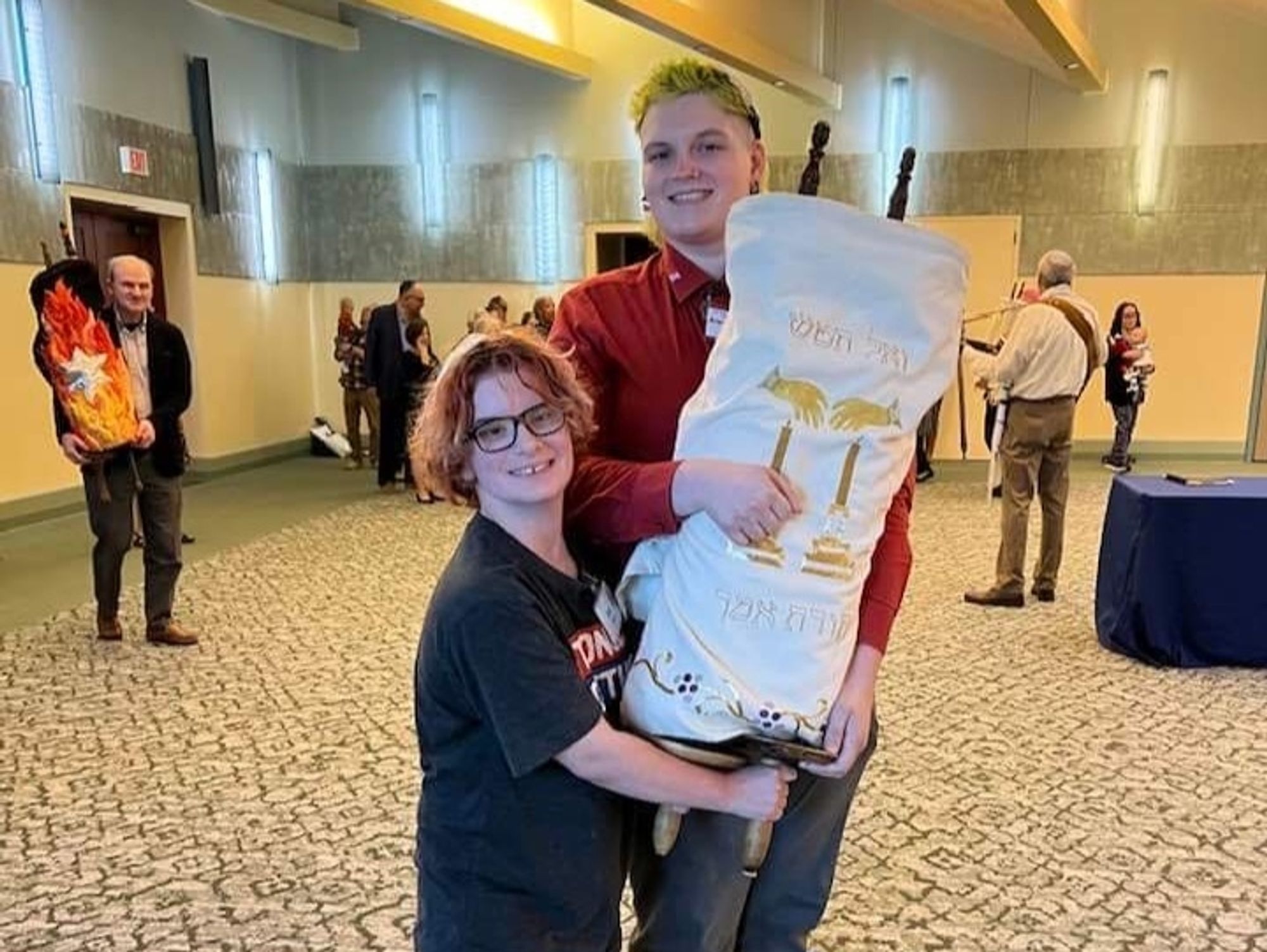 My fiamce, Sid, and I carrying one of the torah scrolls.