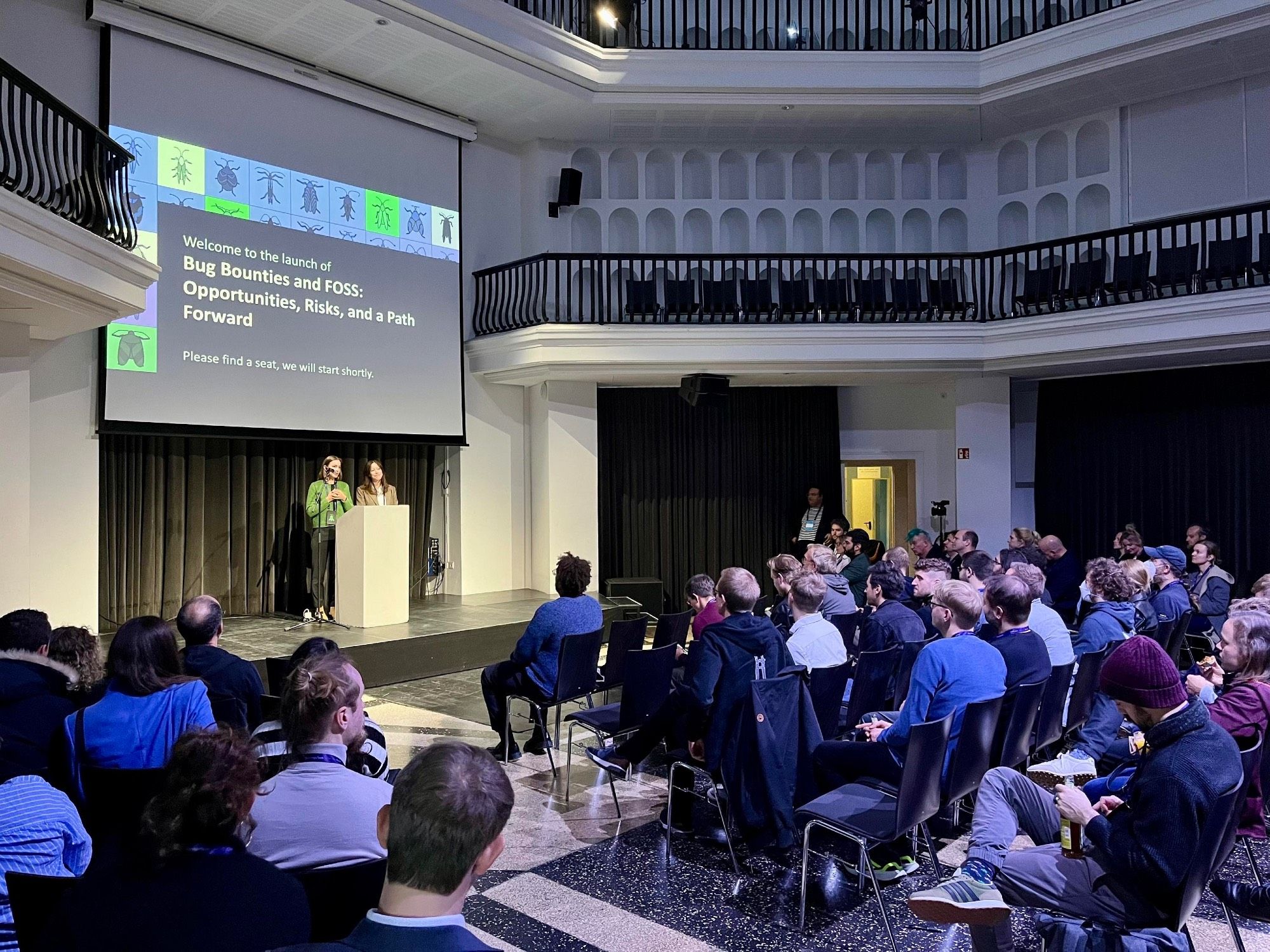 Adriana Groh and Fiona Krakenbürger speaking on stage at Silent Green