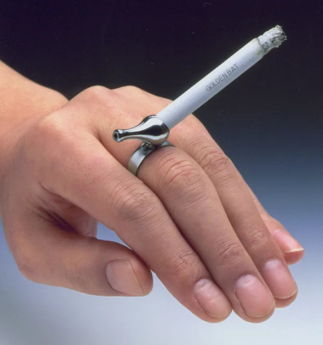 a “yubiwa pipe” which is a ring w a mouthpiece. you can put a cigarette on the other end. hands-free smoking babey