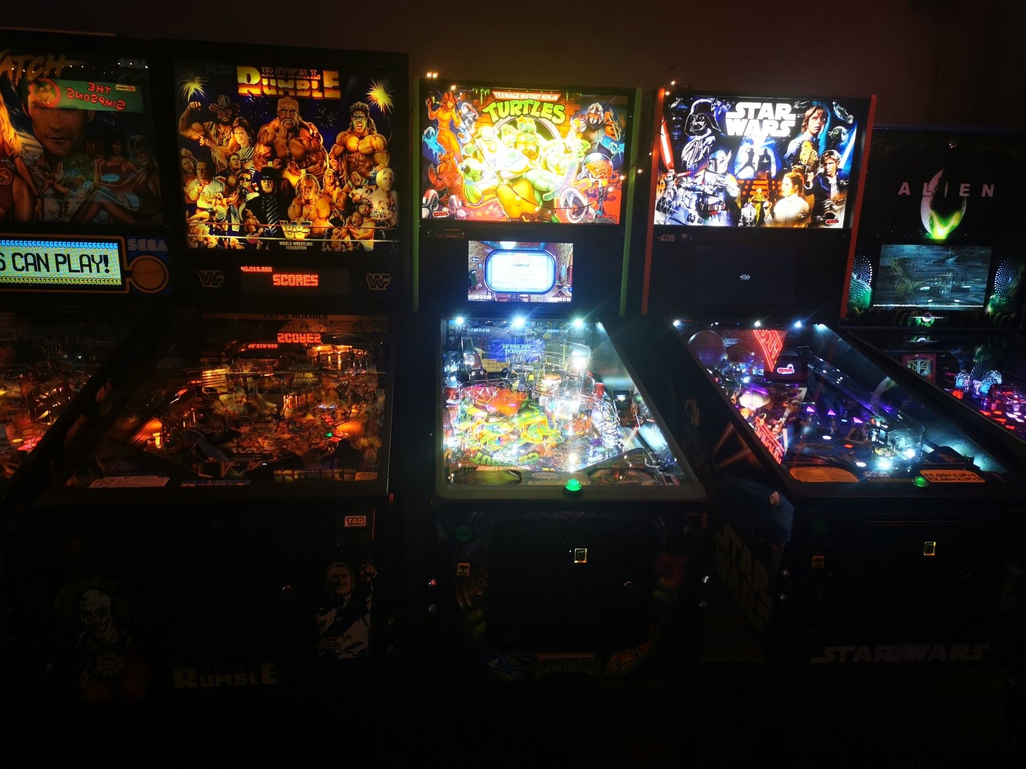 A row of pinball tables, including Royal Rumble, Teenage Mutant Ninja Turtles, Star Wars and Alien - so much fun!