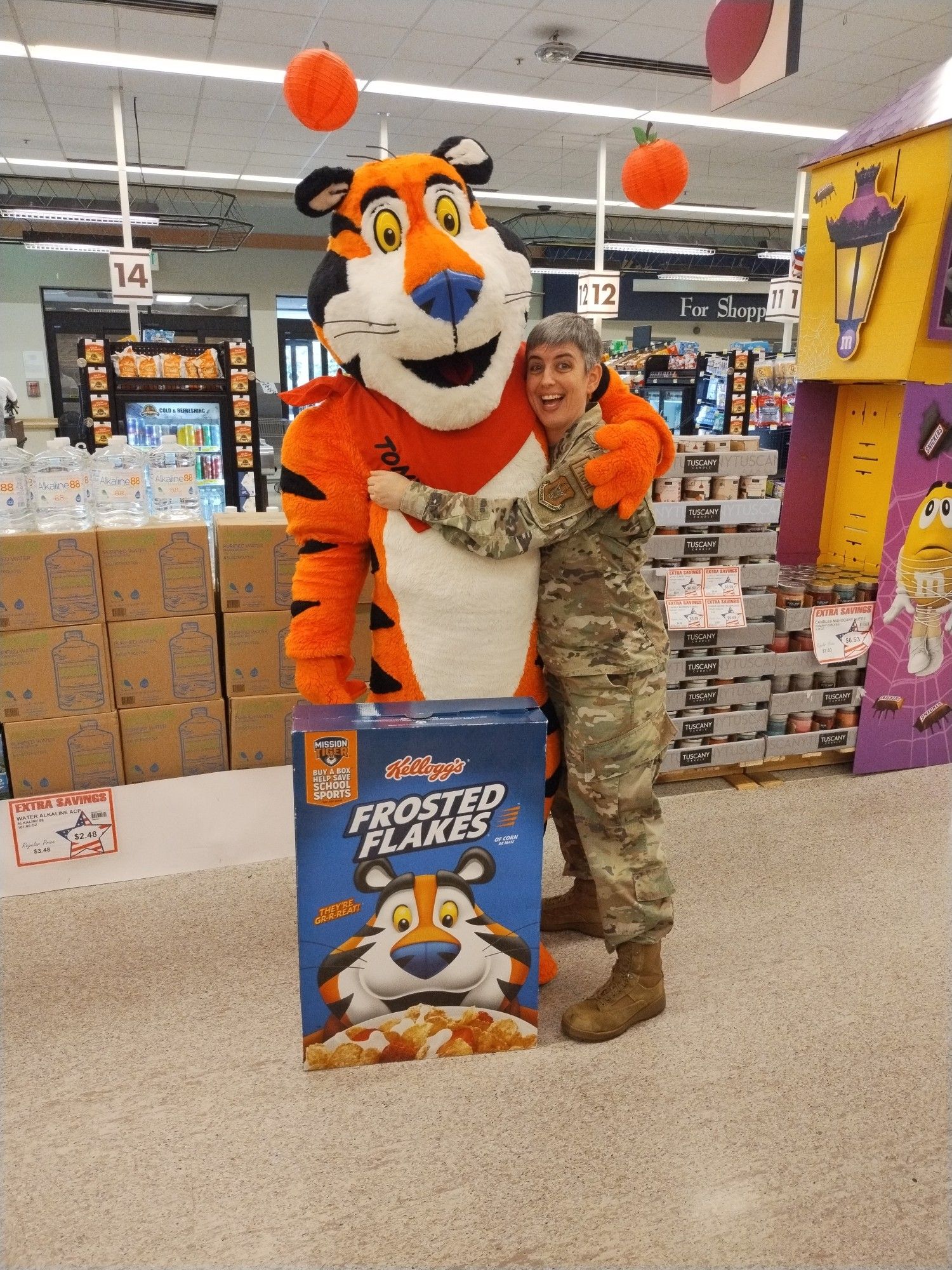 A picture at a military commissary, myself hugging a Tony the Tiger mascot