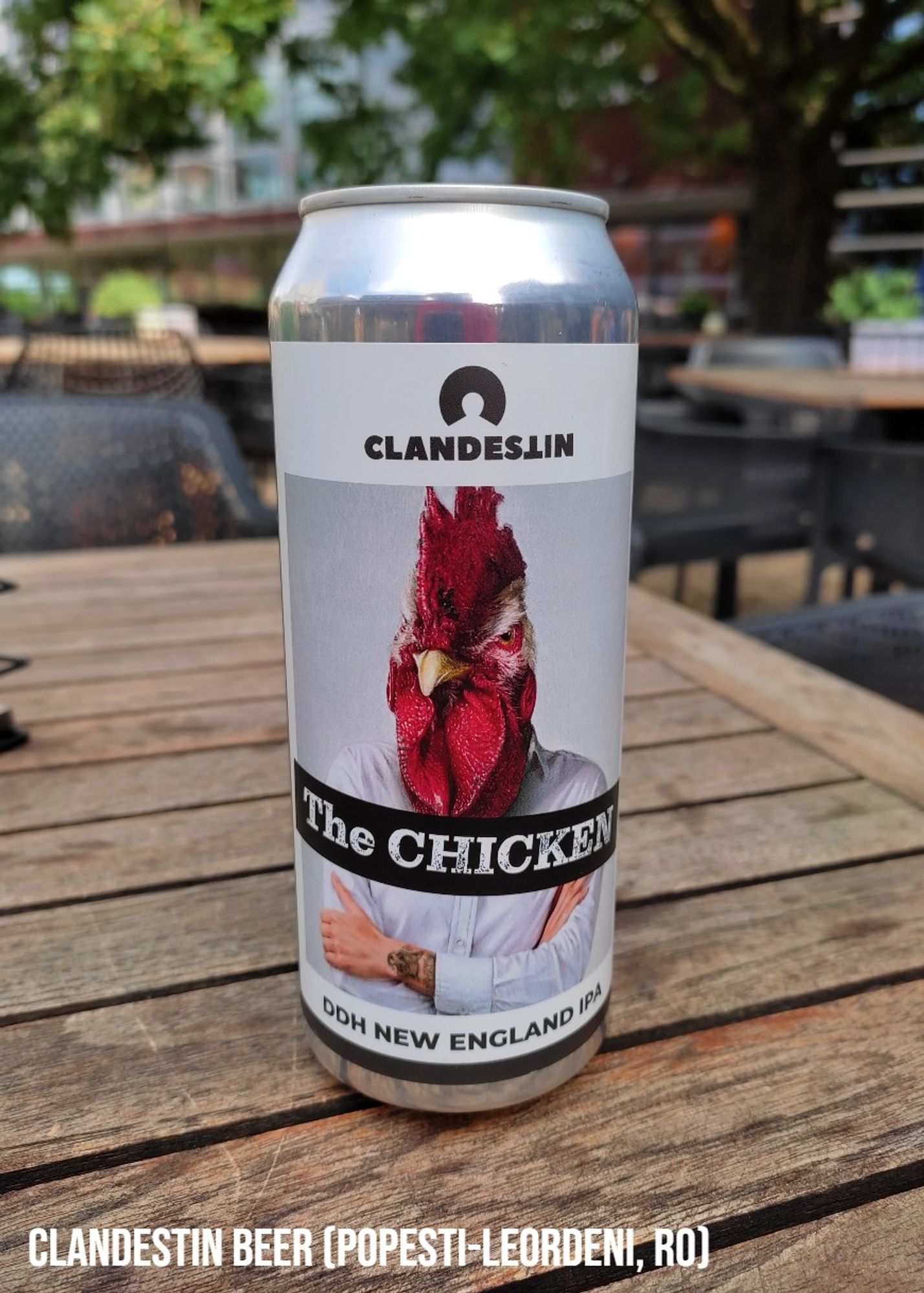 A 500 ml can of beer by Clandestin Beer from Romania.

The label shows the torso of a man in a white business shirt who has a chicken head instead of a human one.