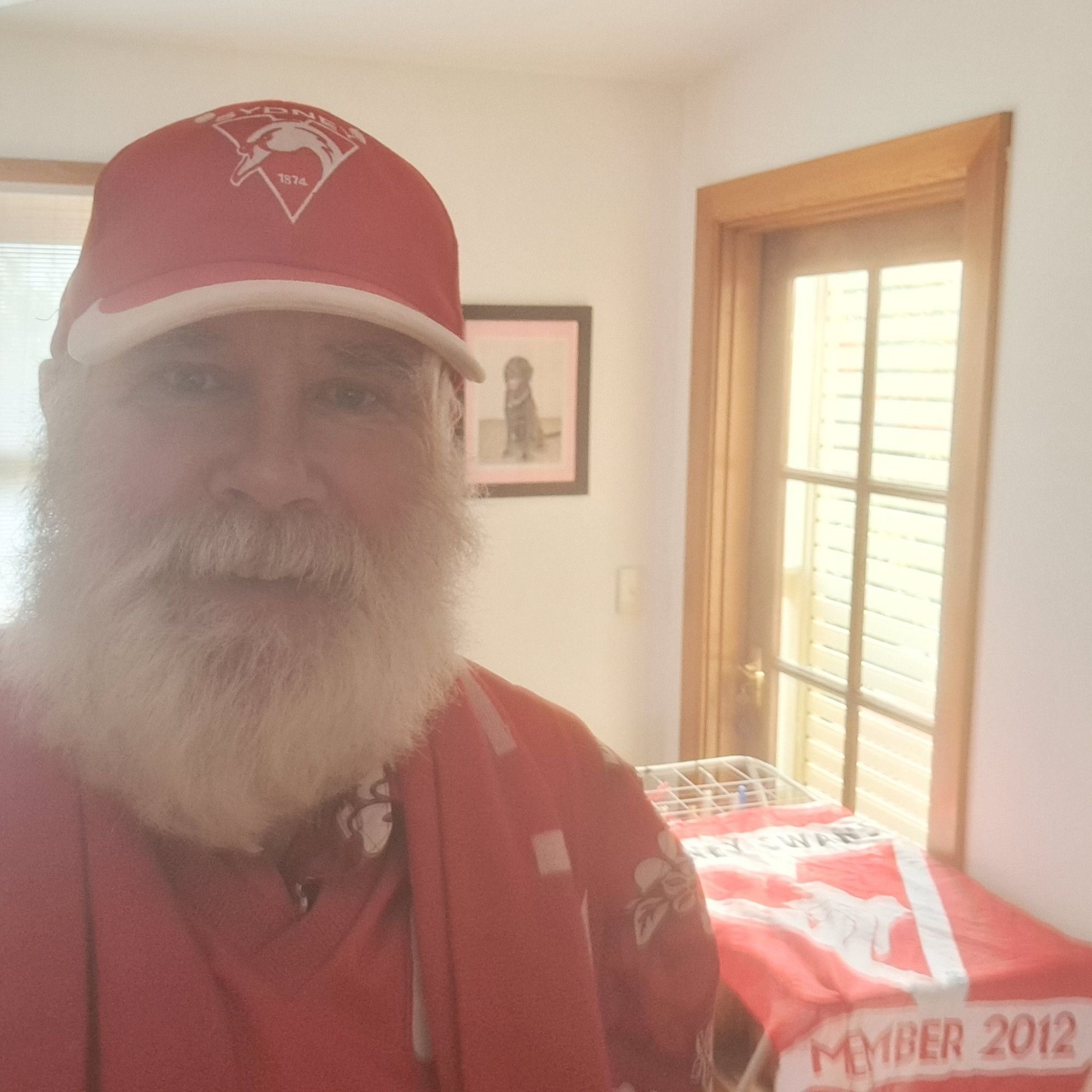 Sunny selfie in my red and white Sydney Swans gear.