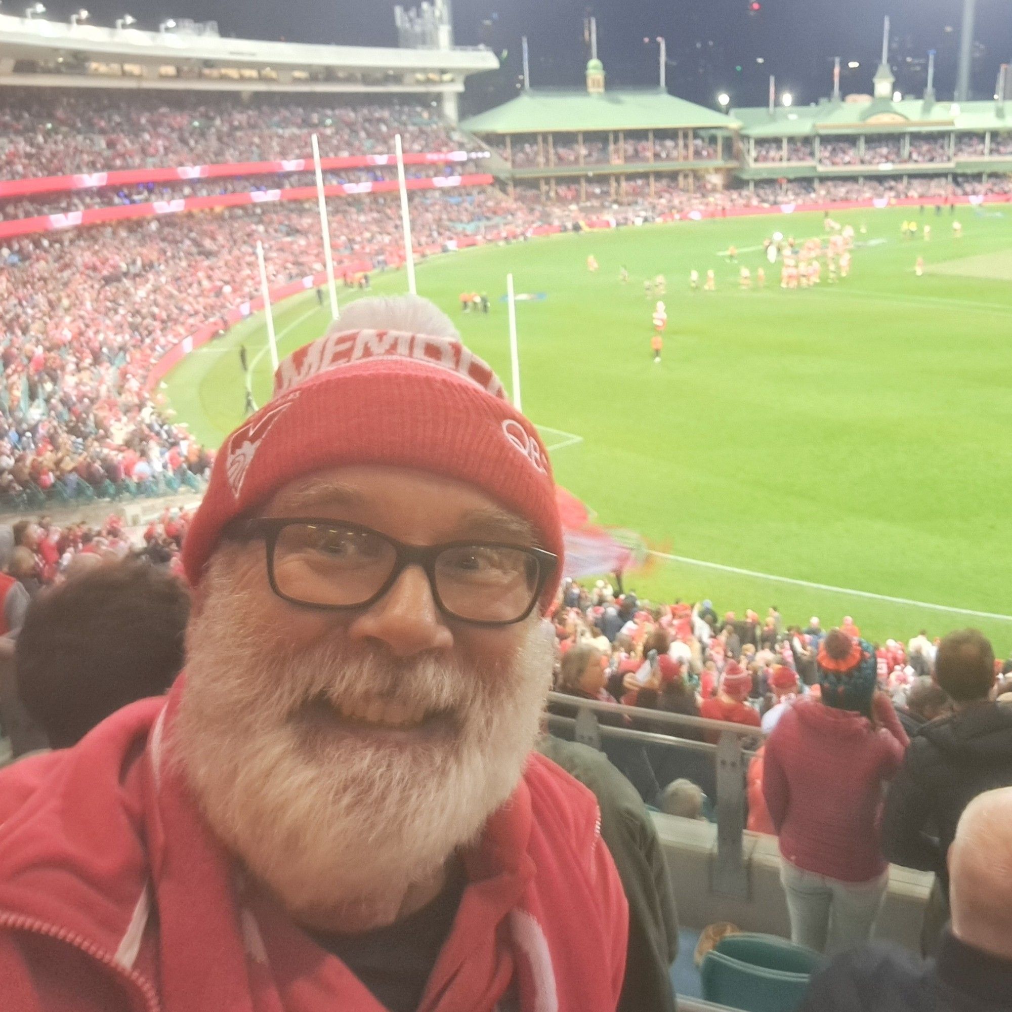 Happy red and white clad selfie at the SCG