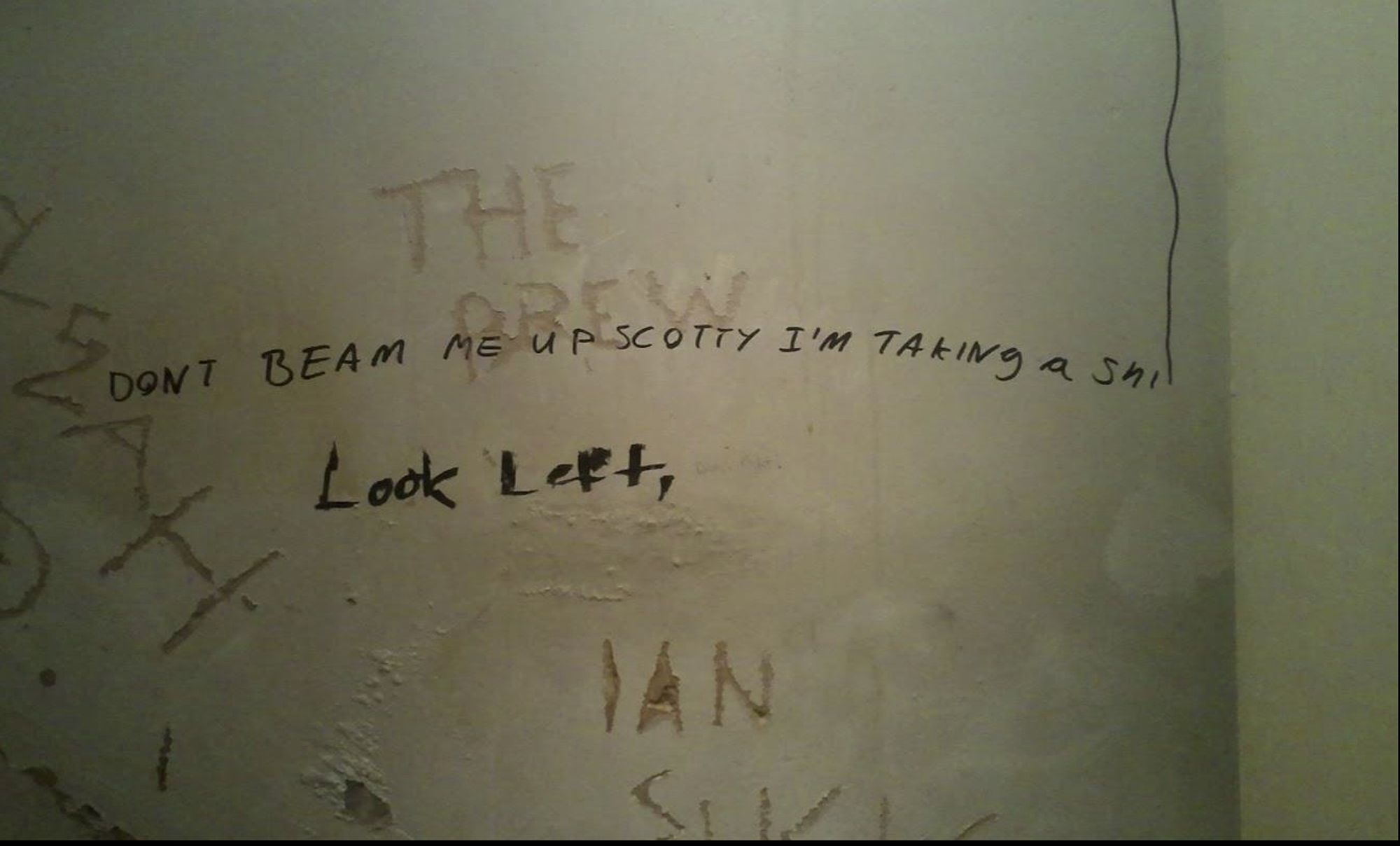 Toilet graffiti that says "Dont Beam Me Up Scotty I taking a sh"...remain text disappears upwards in a line