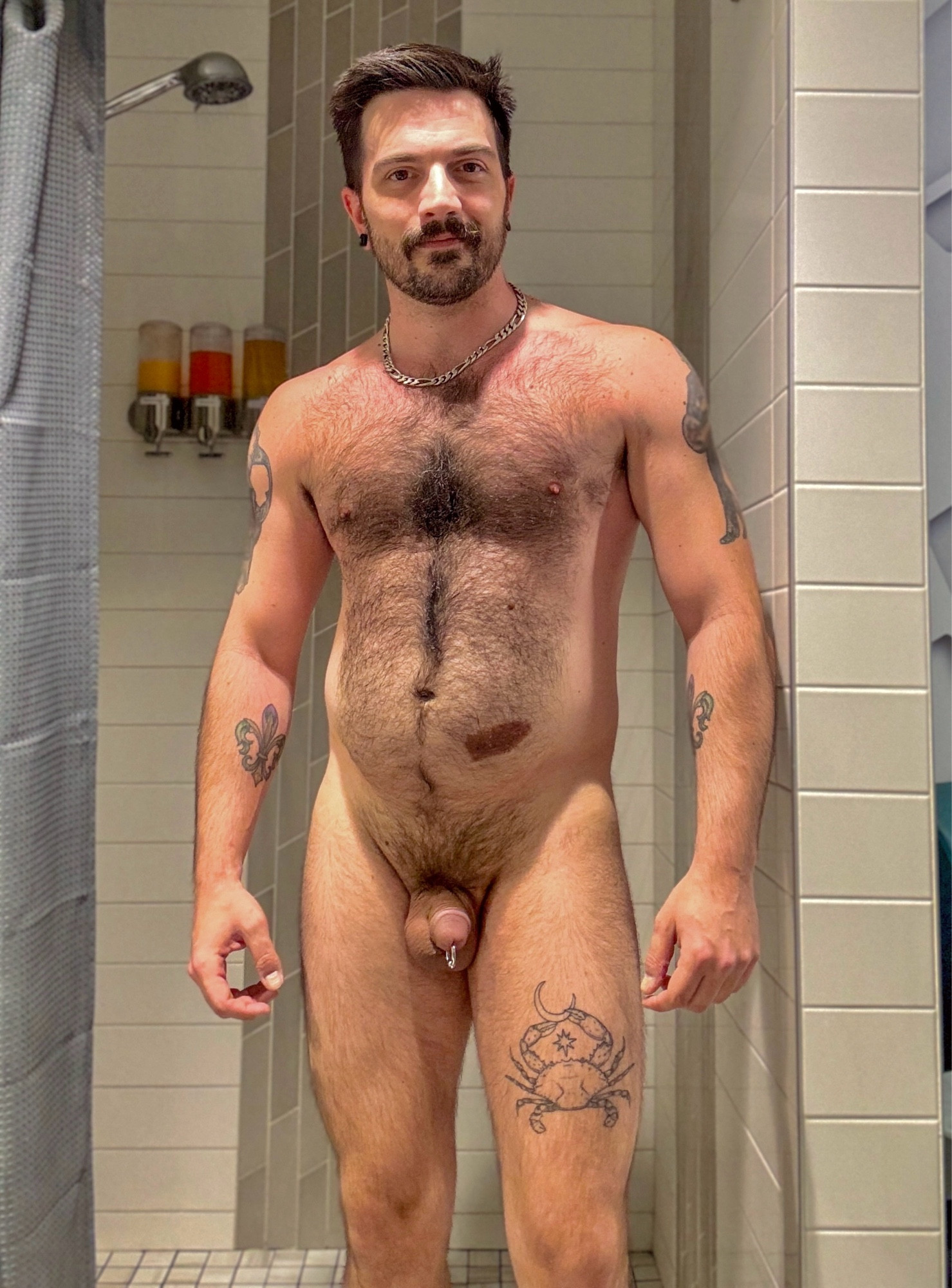 Hairy bear cub naked in a gym shower