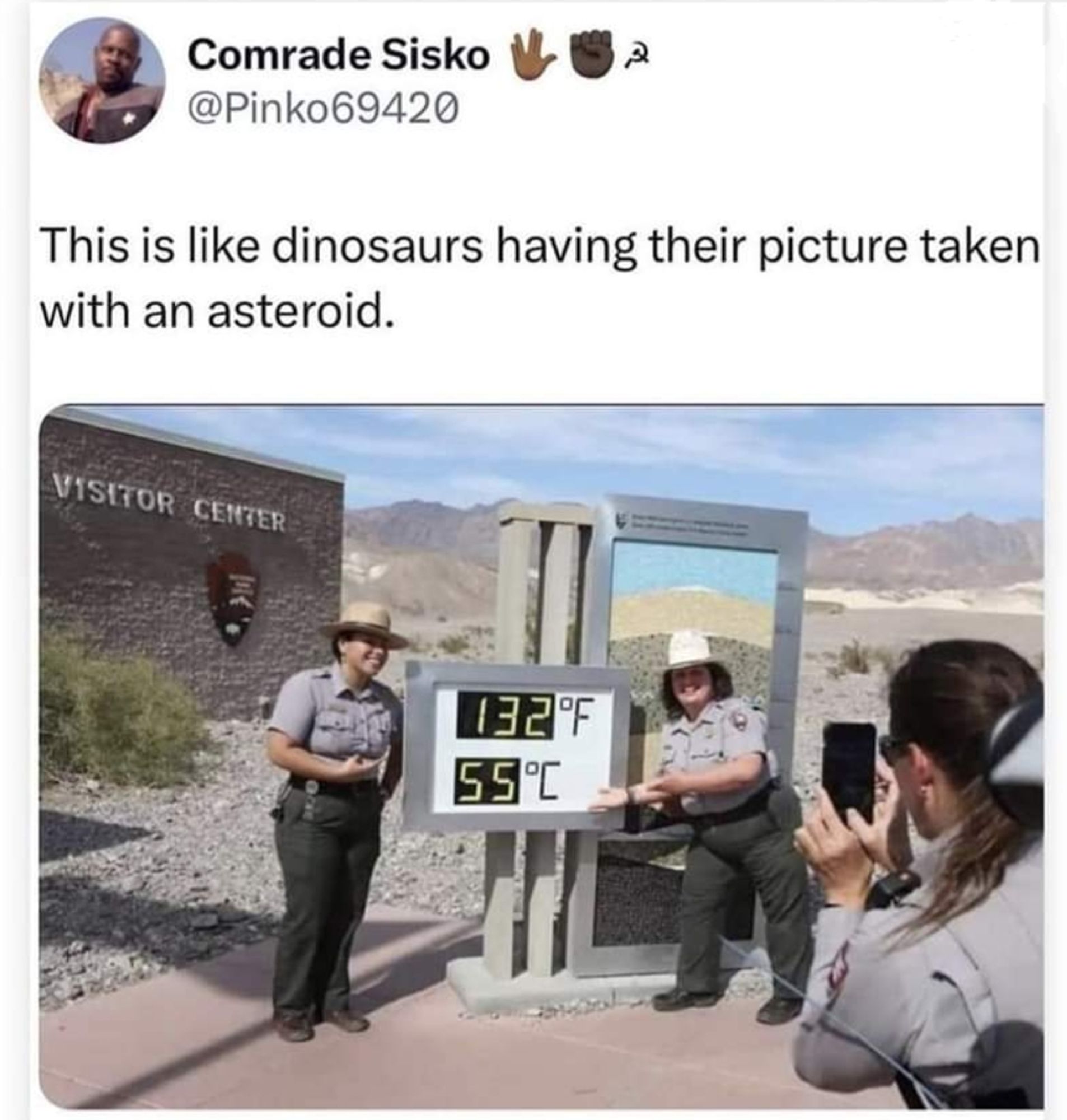 Cops in Arizona, taking a picture with a sign that indicates the temperature (55'C)