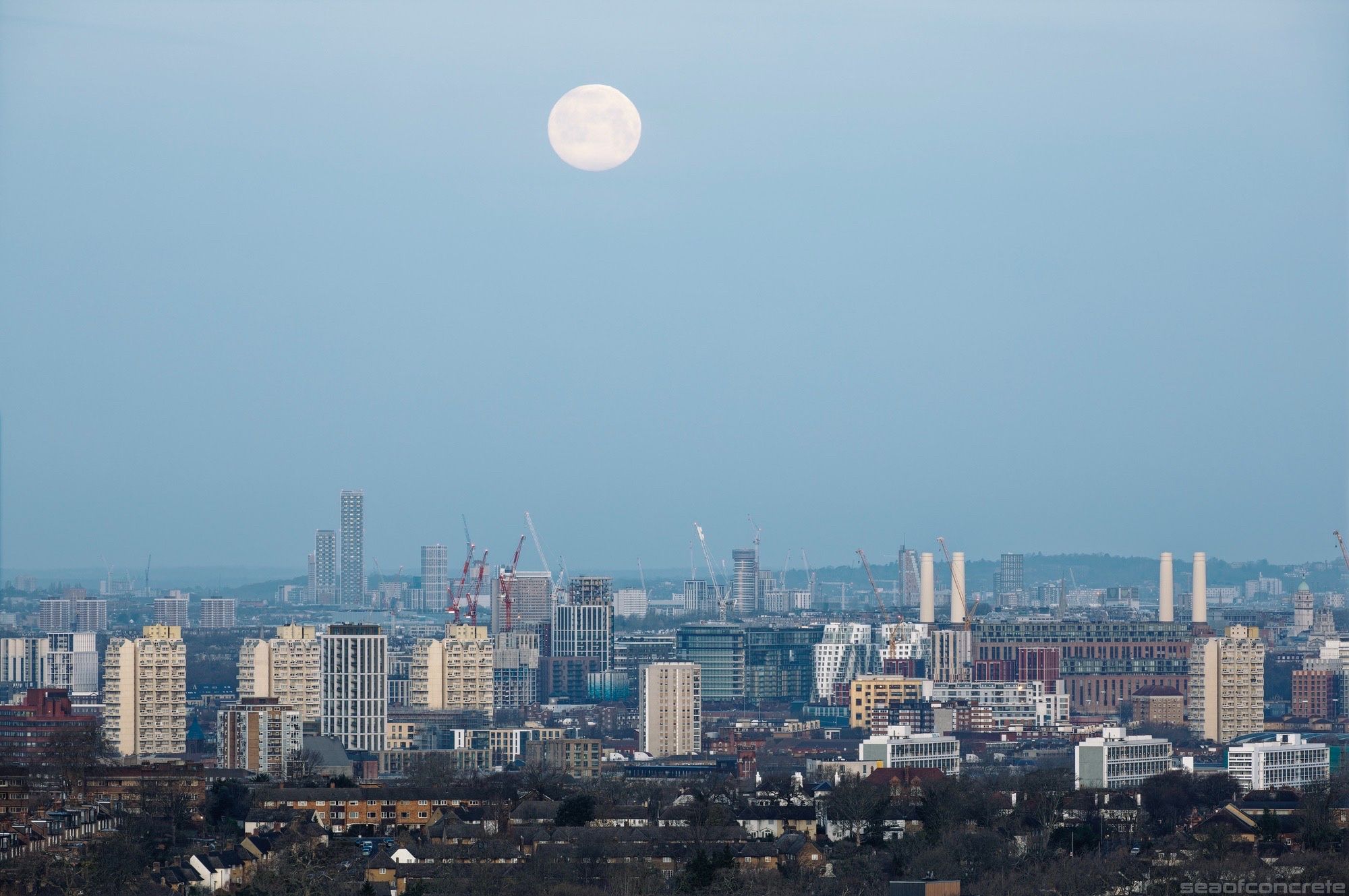 This photo was captured from the Dawson Heights estate at sunrise on a cold February morning. The moon is in descent above George Finch’s iconic Grantham Road estate tower blocks. Battersea Power Station and the Loughborough Estate are also visible.