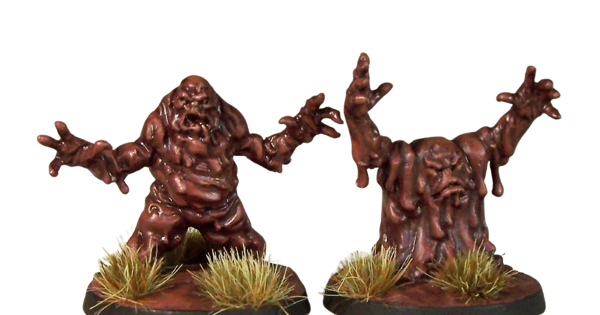 two model mud-men, humanoid creatures forming from the pools of swamp that surround them.