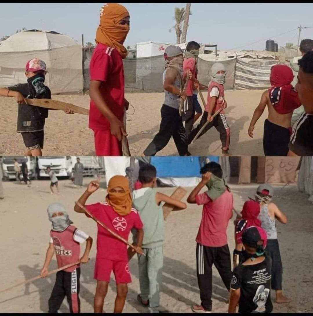 Here are several children wearing kufiya on their heads and holding sticks just like Sinwar 