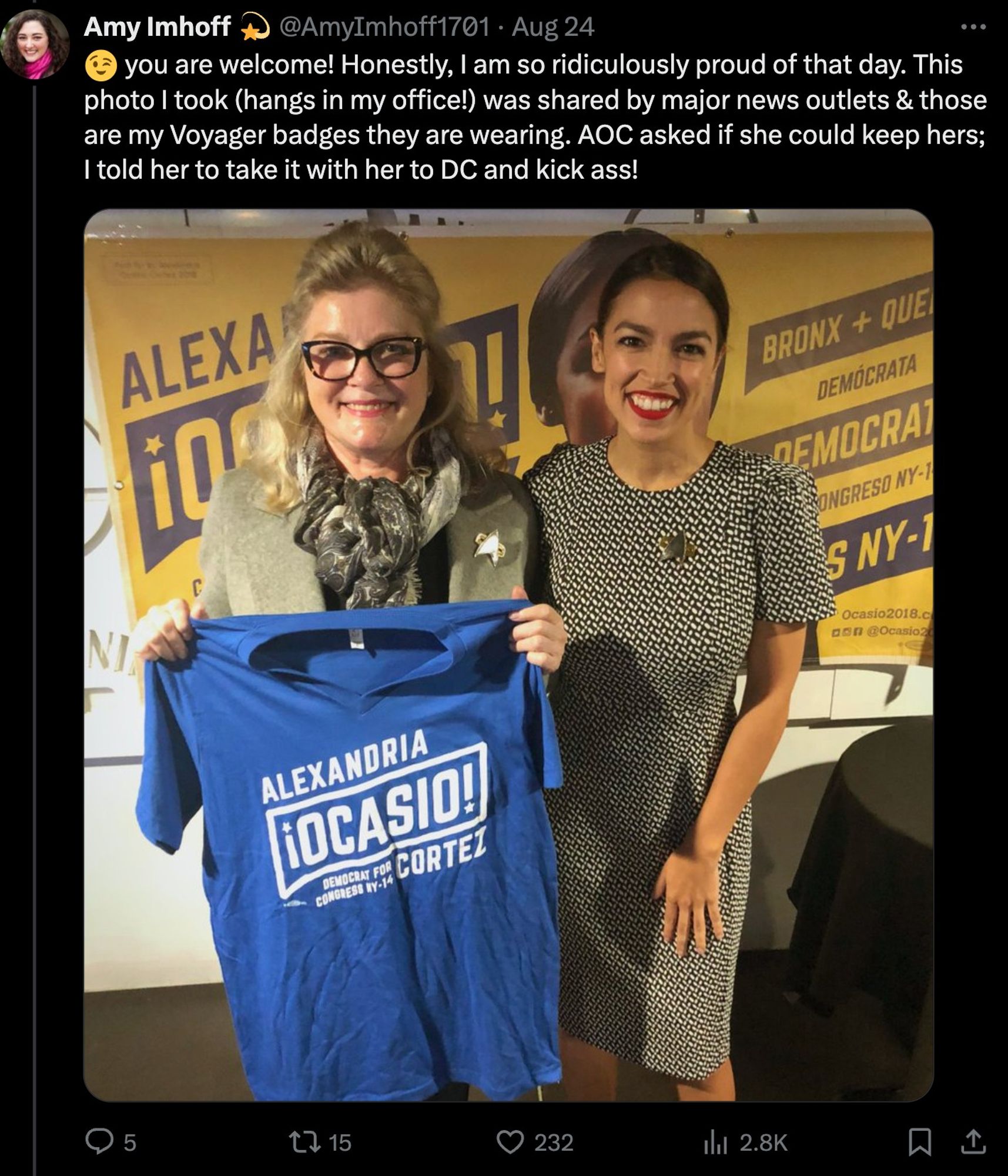 tweet from @AmyImhoff1701 showing AOC posing for a photo with Star Trek actress Kate Mulgrew, both wearing Voyager badges.