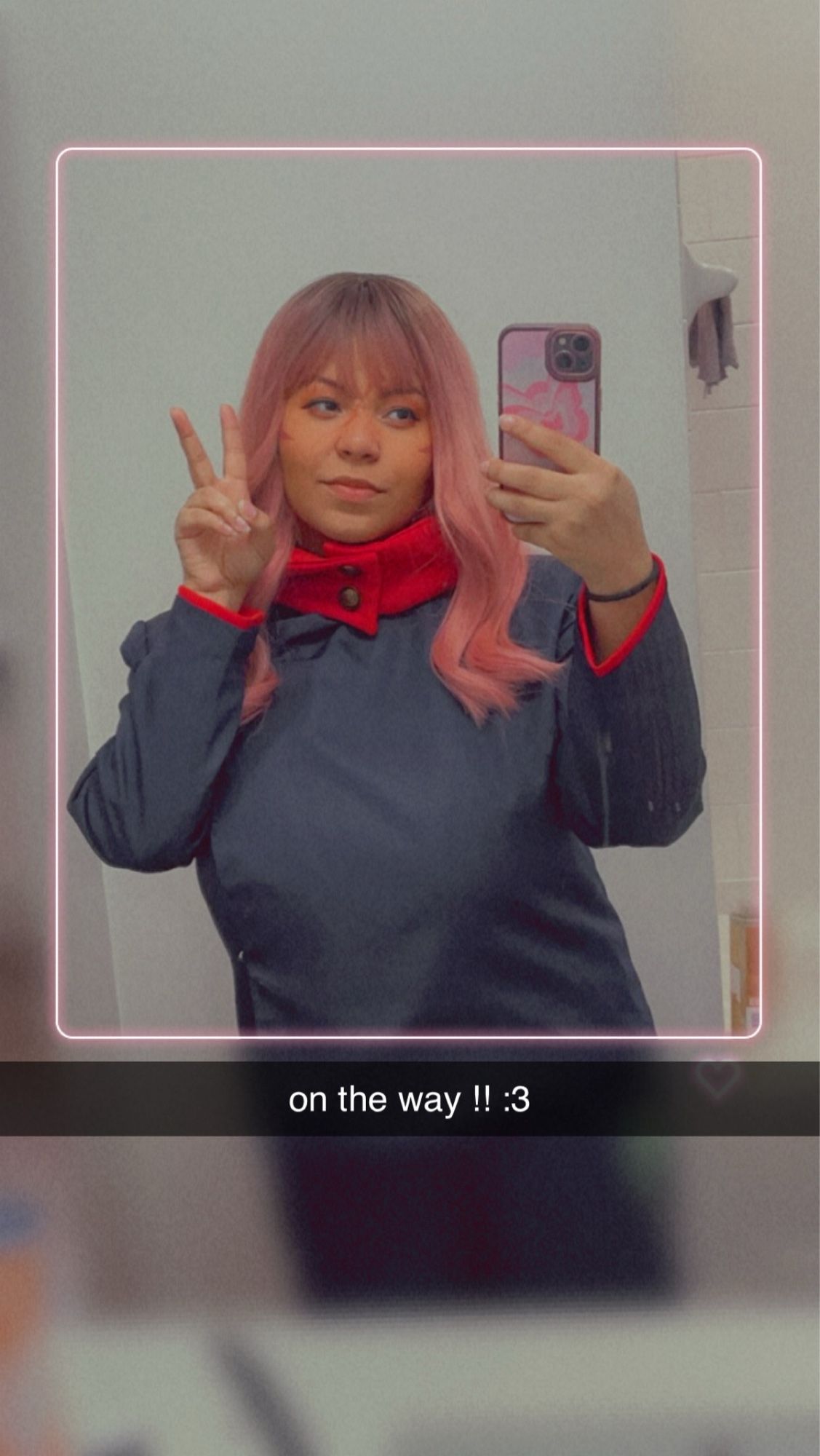 Mirror selfie of a fem!Yuuji Itadori cosplay with the text “on the way !! :3”