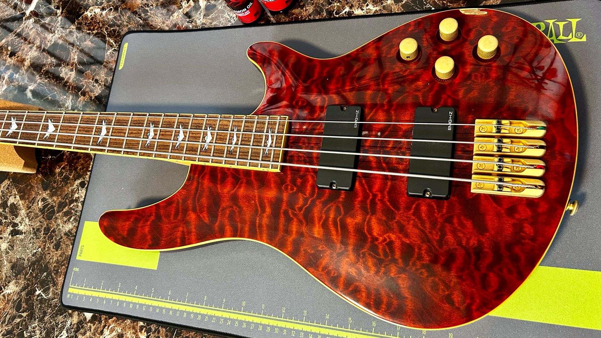 A red Schecter C4 bass