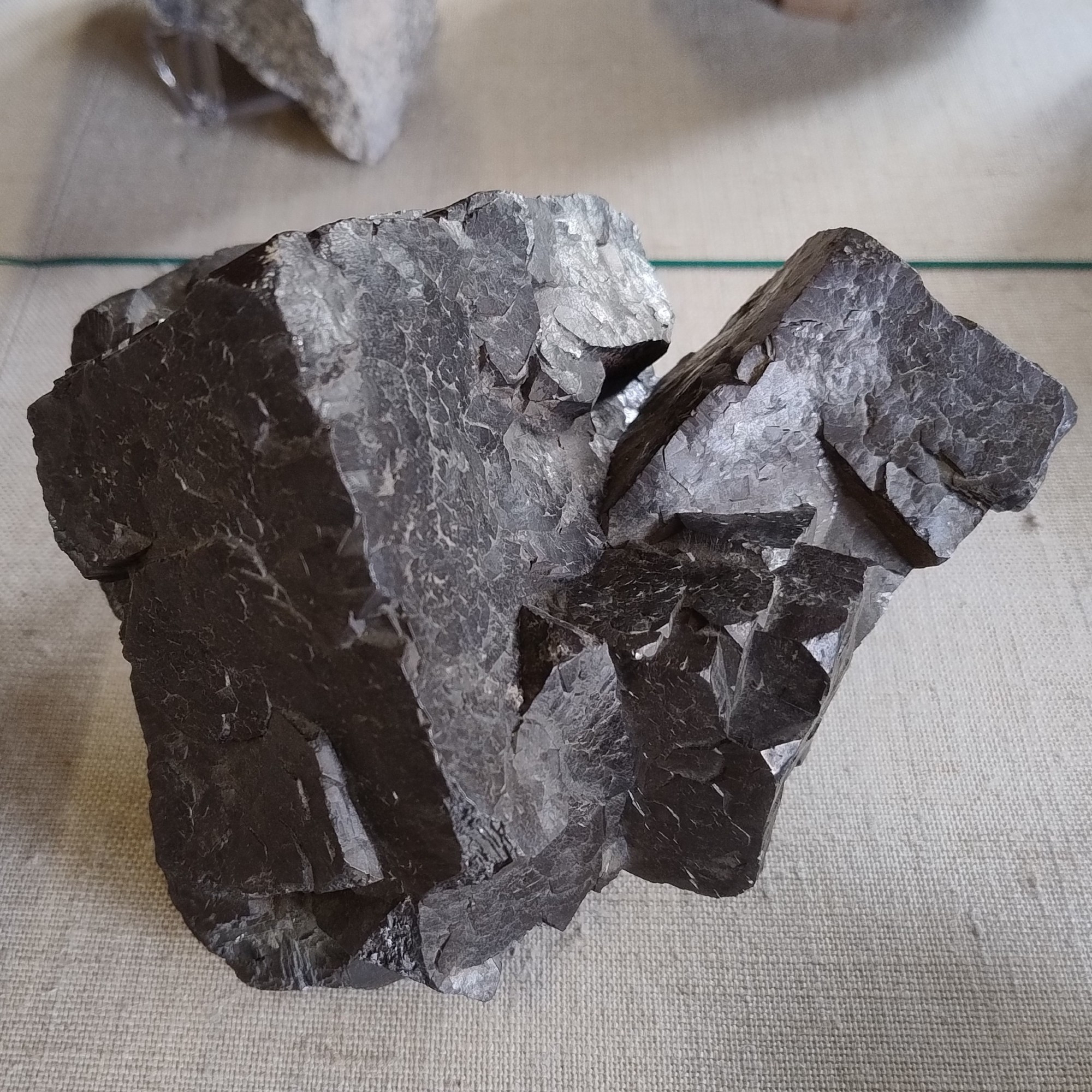 A group of composite galena cubes, a dull grey colour. From Albergaria Velha, Portugal.

Specimen on display in the Natural History Museum, London.
